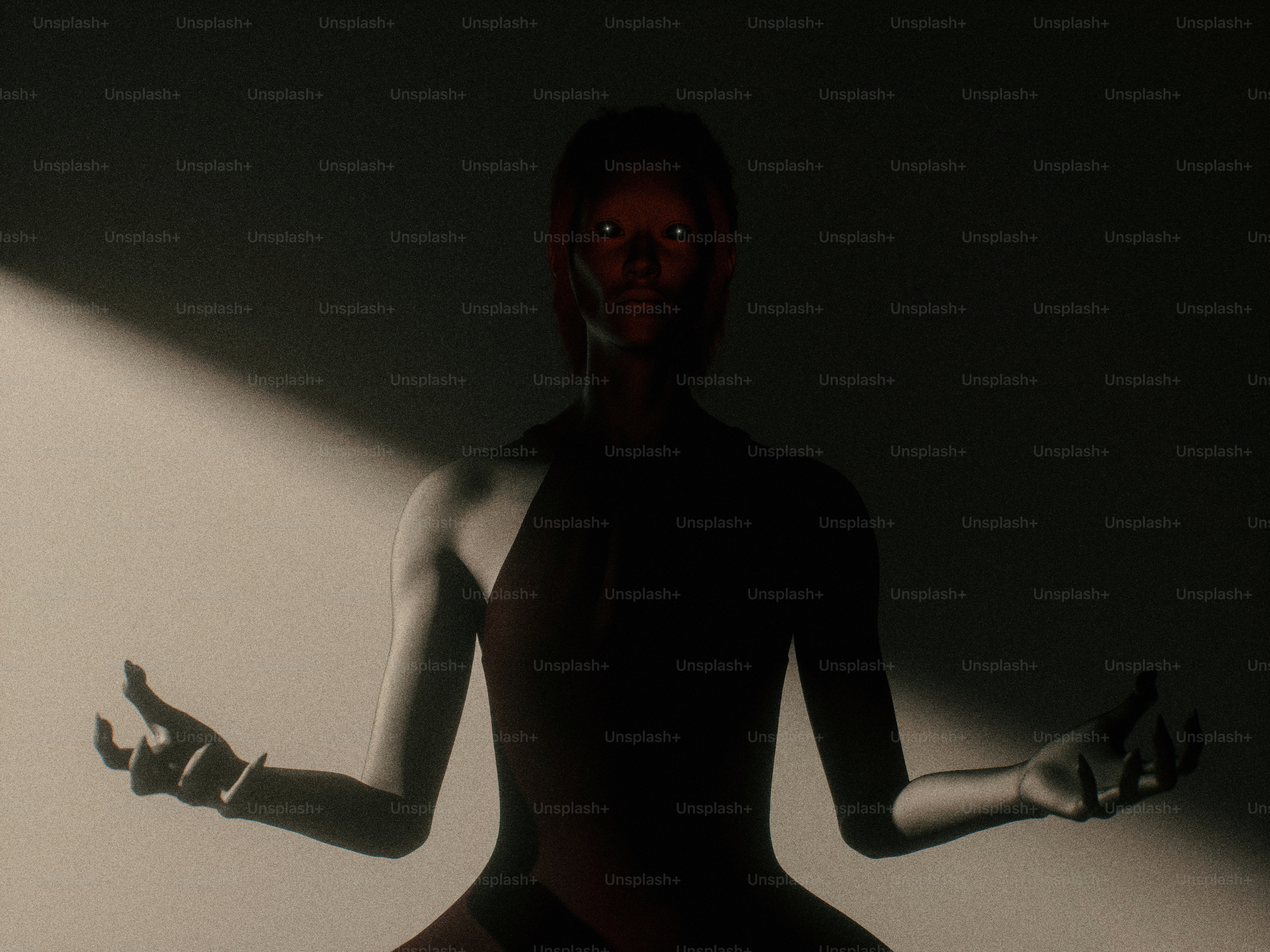 A person in a dark leotard with glowing eyes in a spotlight