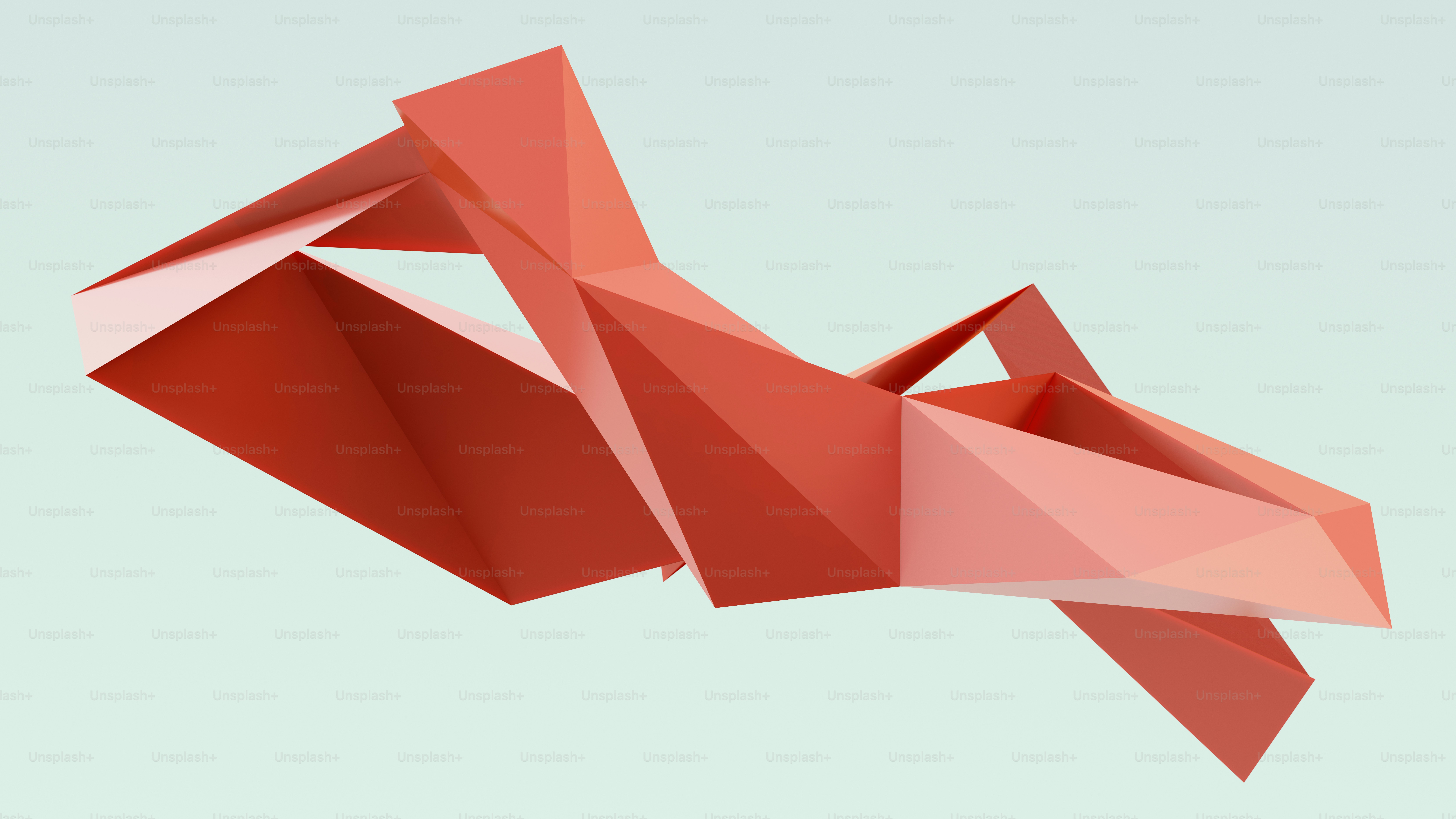 A red low poly geometric sculpture against a pale blue background