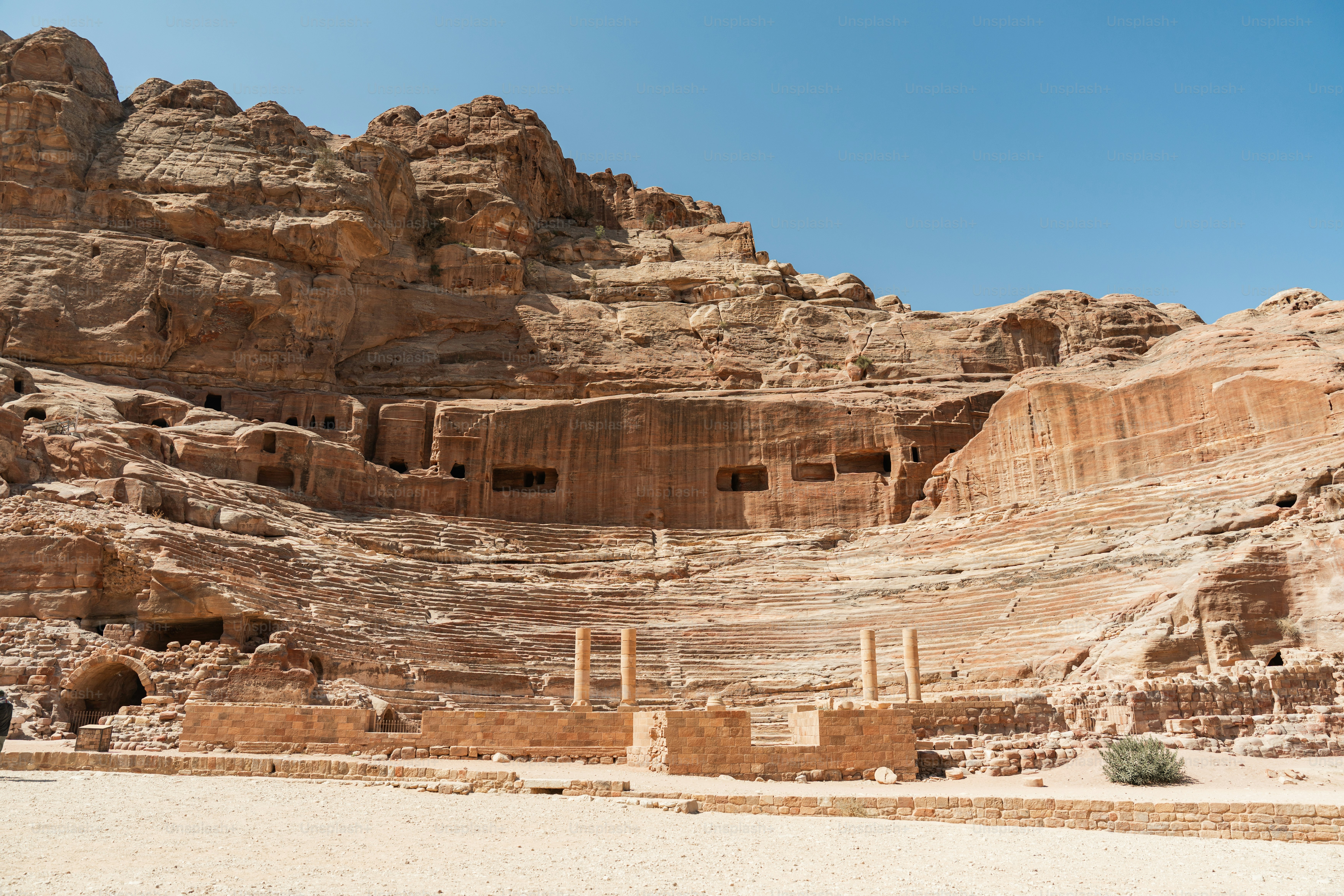 The ancient rock-cut theater carved into sandstone cliffs in Wadi Musa, Jordan