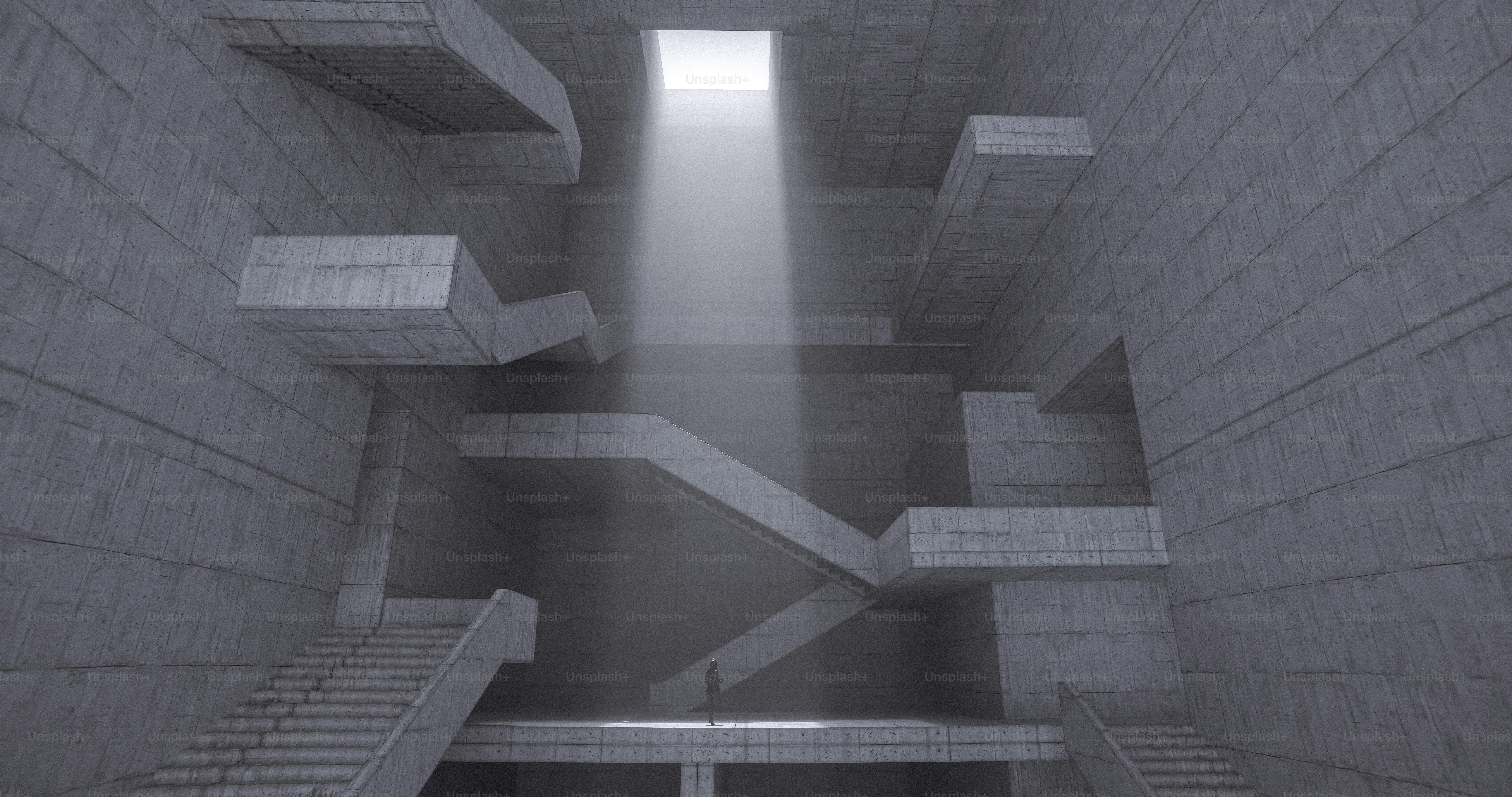 A person in a vast concrete hall with staircases under a bright skylight
