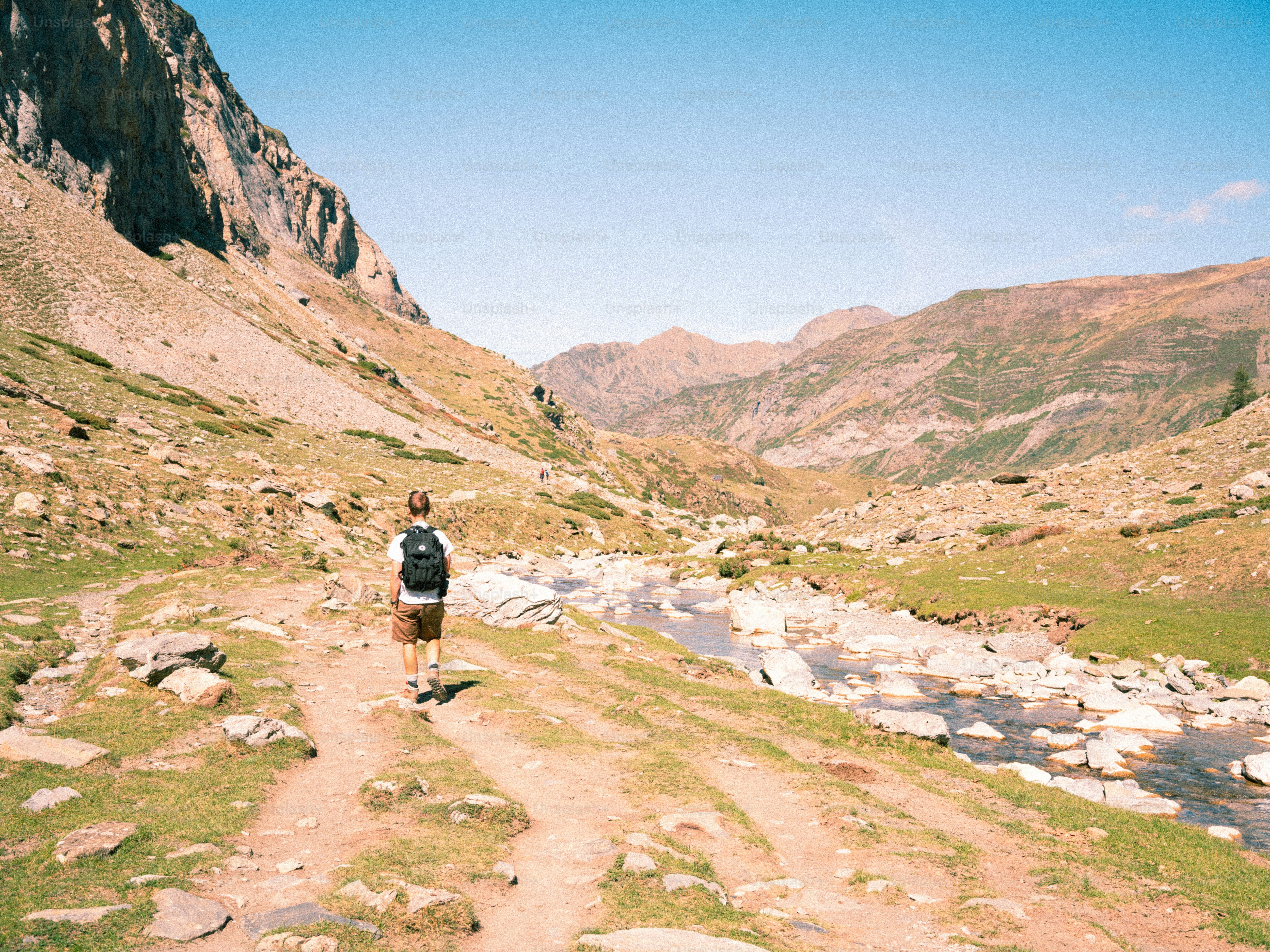 Mountain stream in rocky valley - Photo on Unsplash+