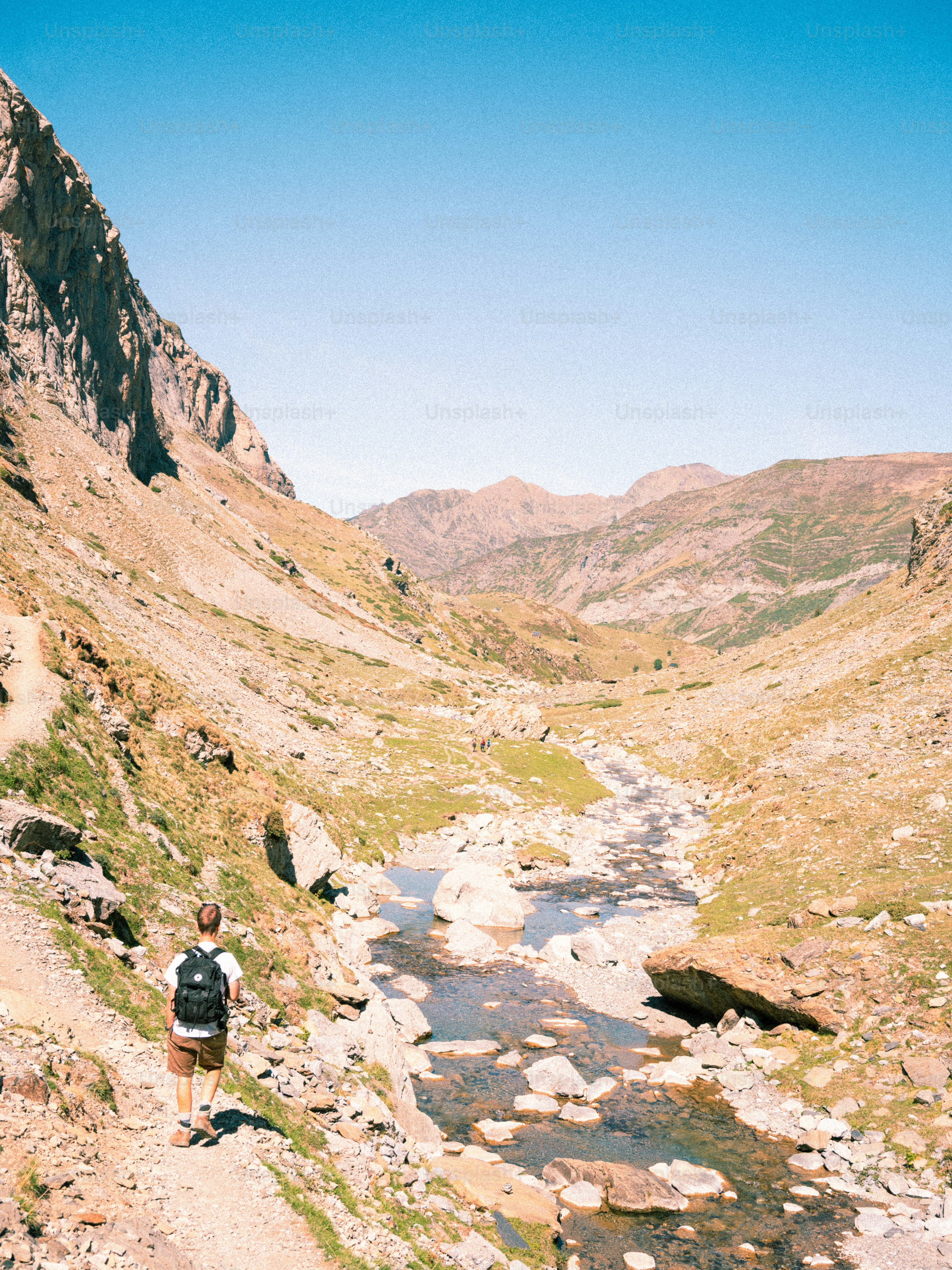 Mountain stream in rocky valley - Photo on Unsplash+