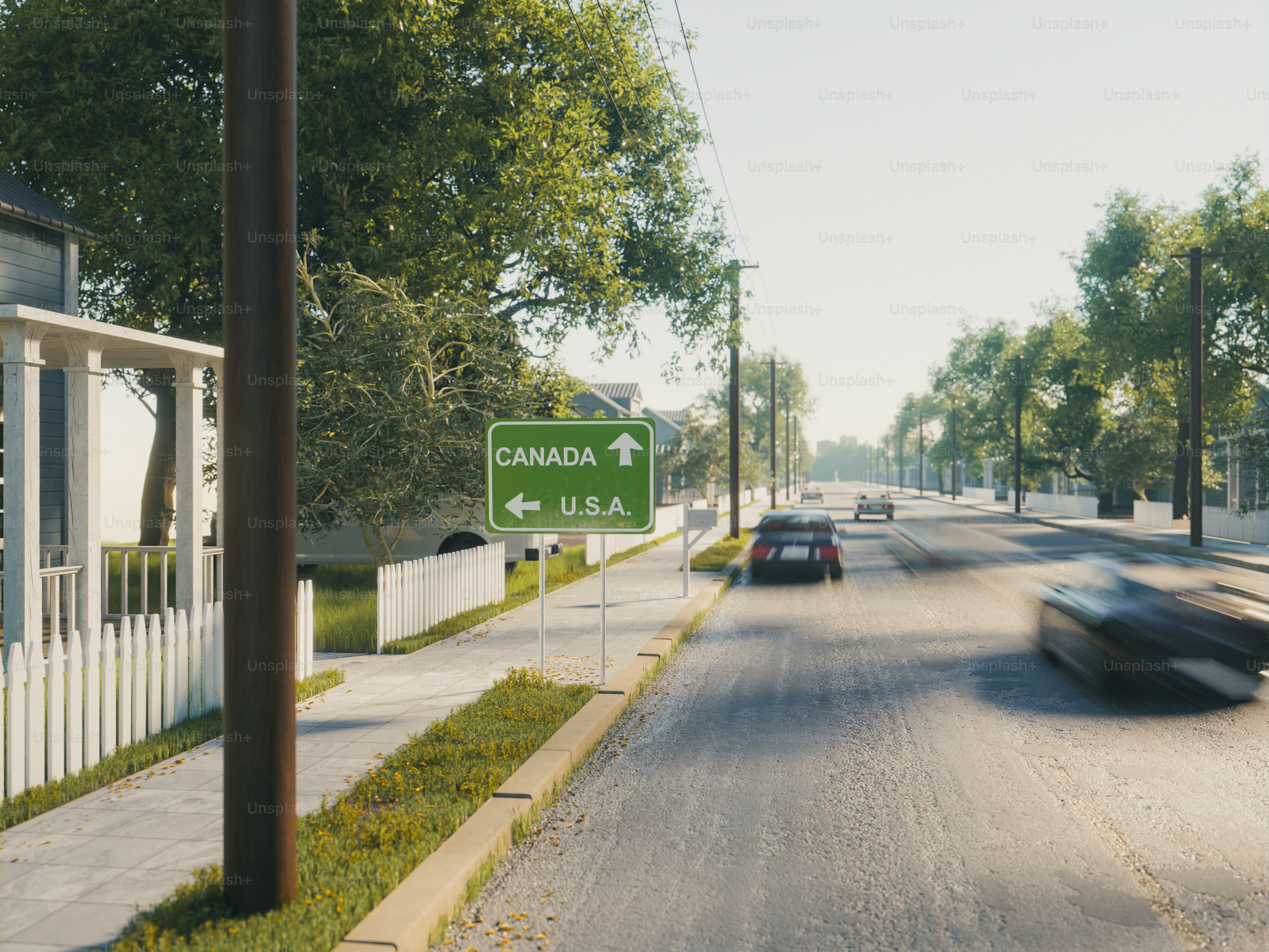 Uma placa de trânsito verde apontando para o Canadá e os EUA em uma rua suburbana