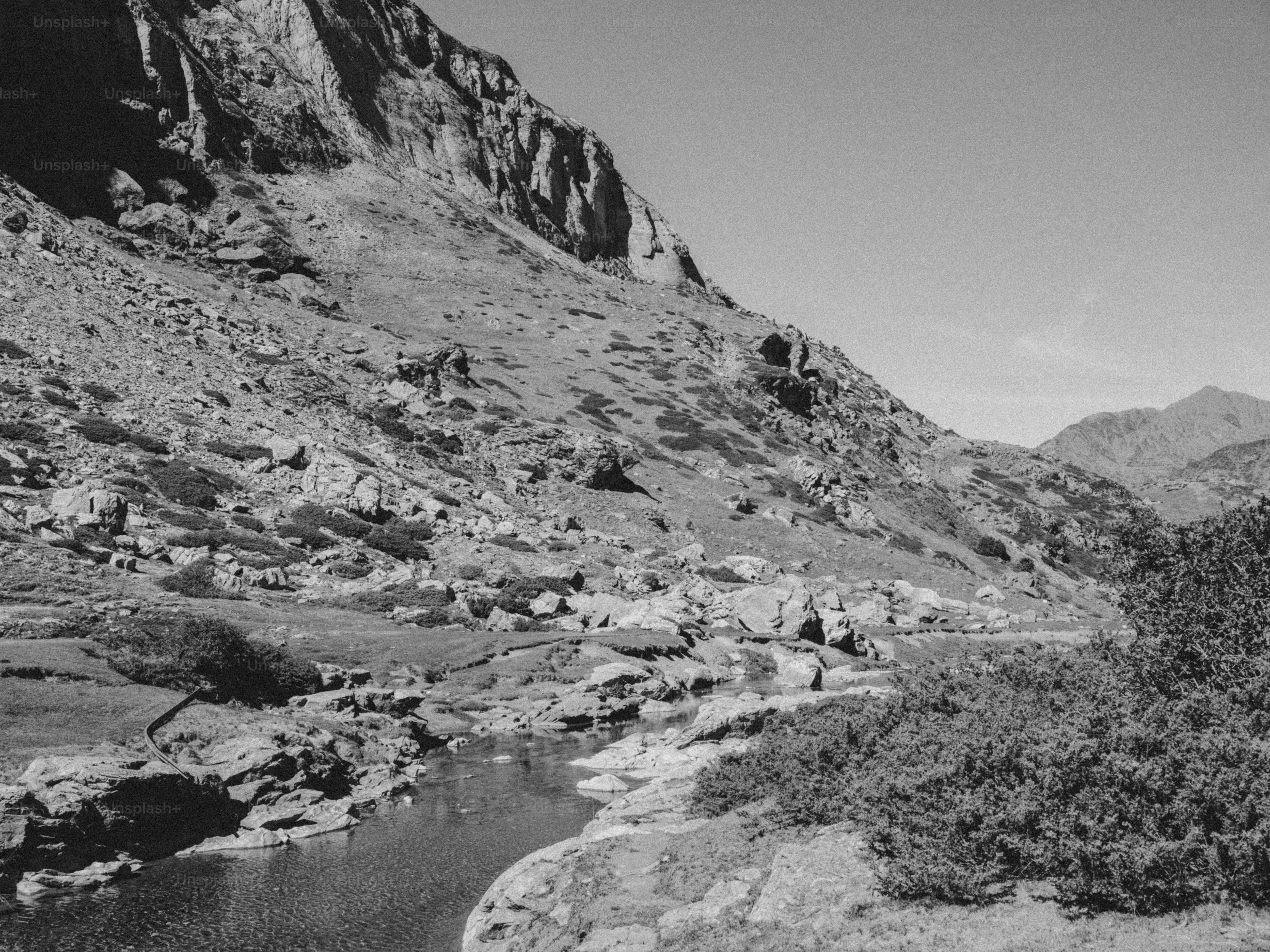 Rocky stream in mountain valley - Photo on Unsplash+