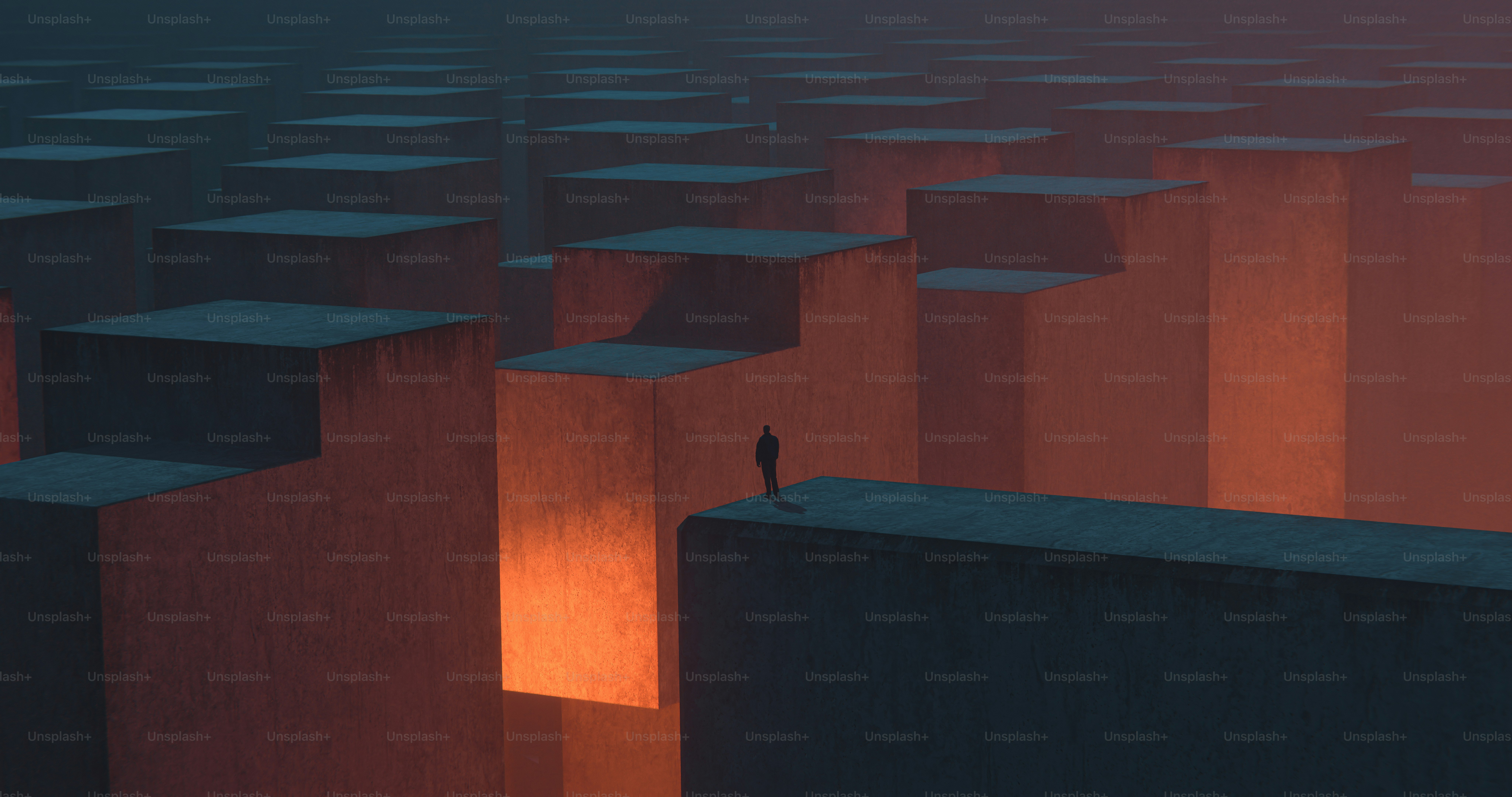 A person on a tall concrete block among many others in warm light