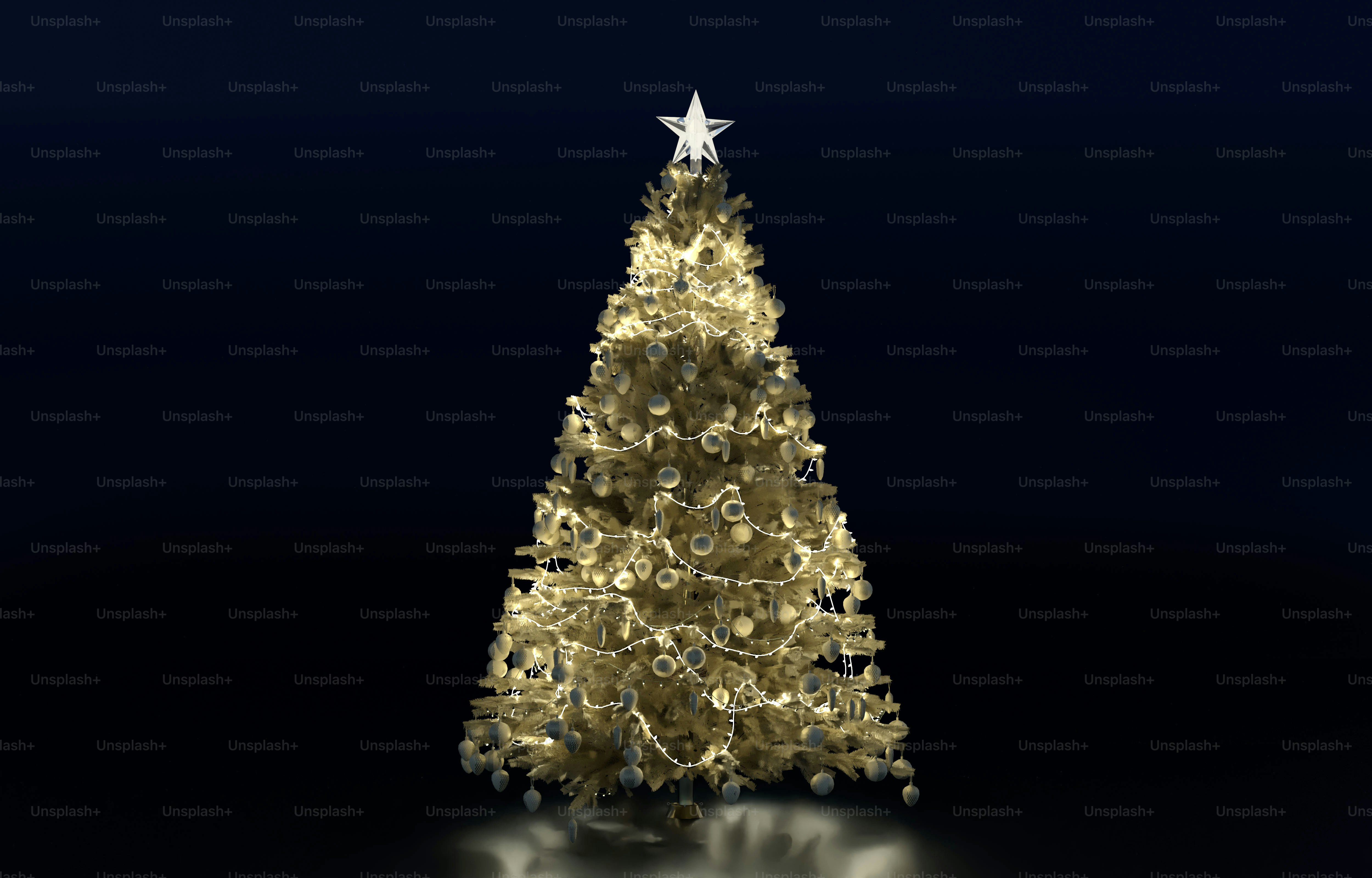 A white Christmas tree decorated with glowing lights and ornaments against a dark background