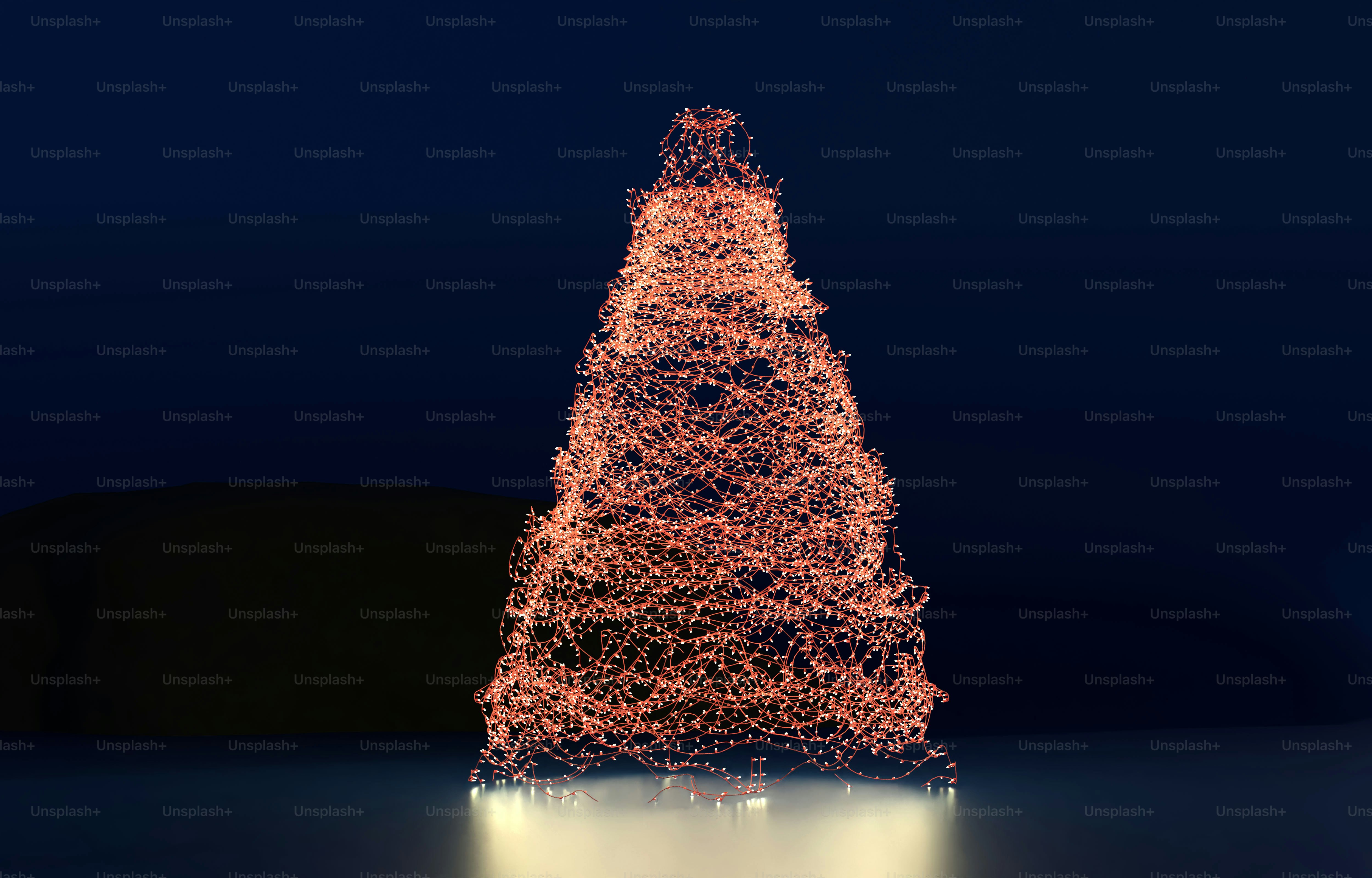 A conical sculpture made of tangled copper wire illuminated against a dark background