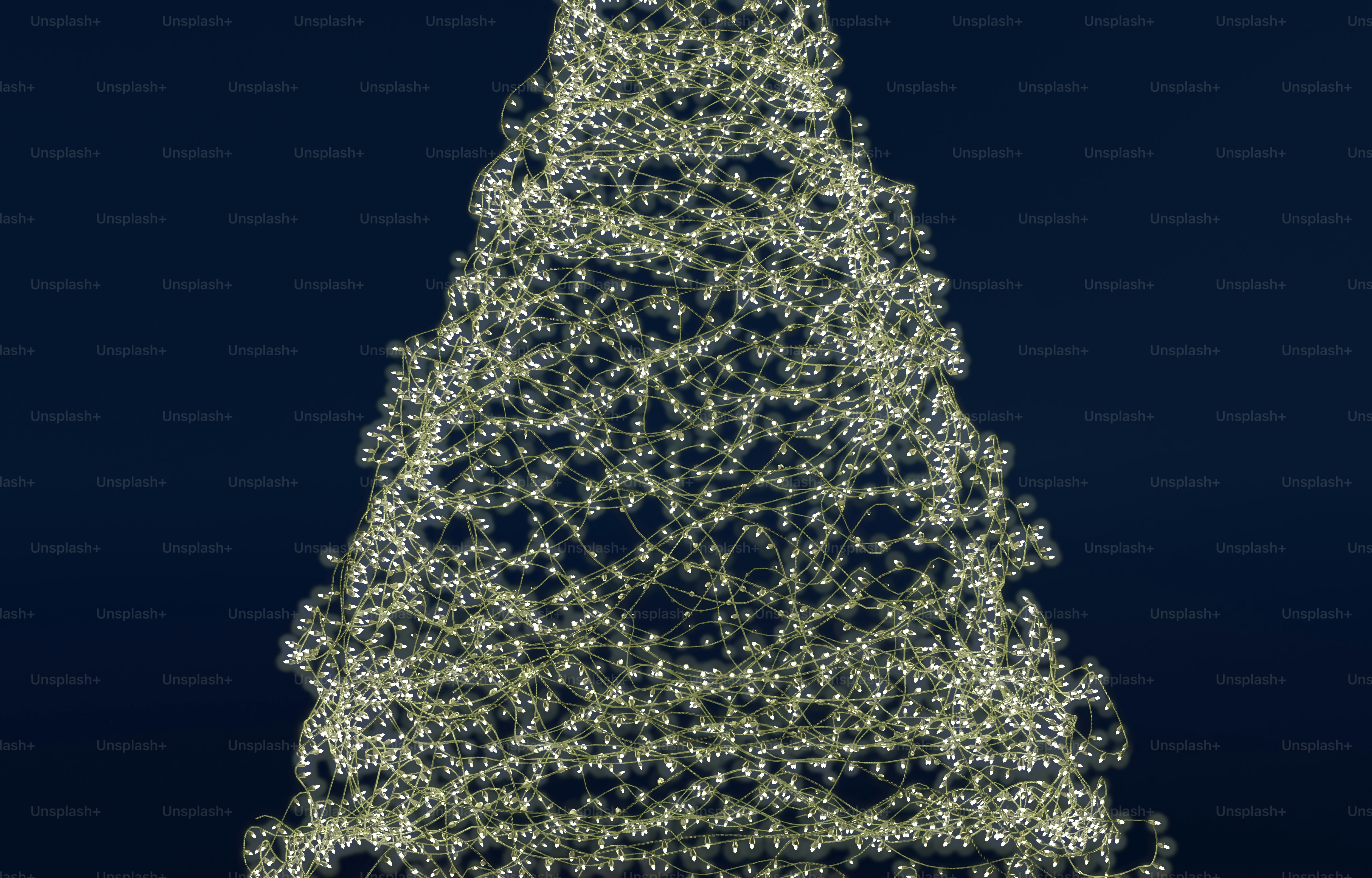 A cone shaped structure made of glowing white fairy lights against a dark background