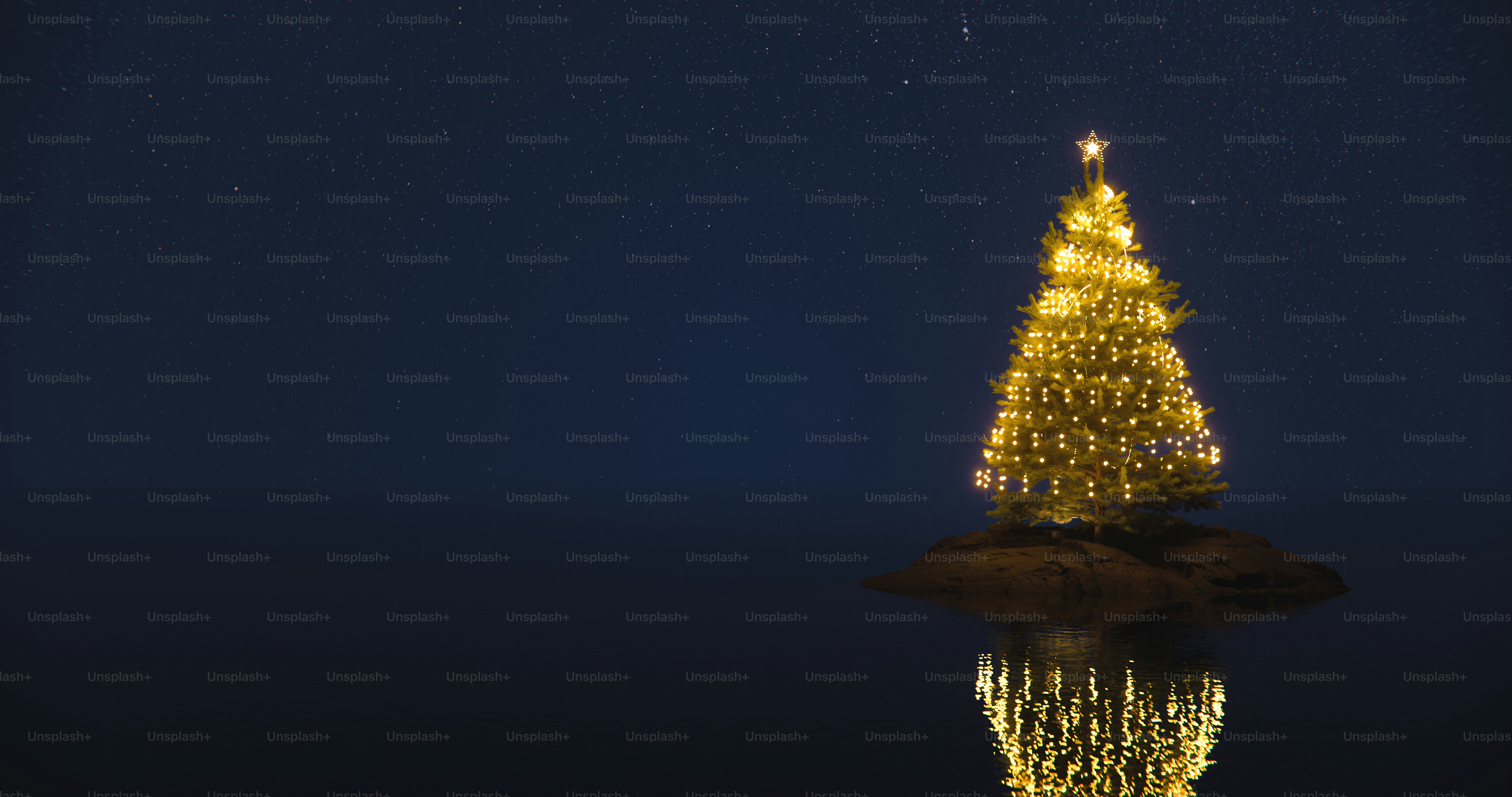 A glowing Christmas tree on a small rocky island at night under starry skies