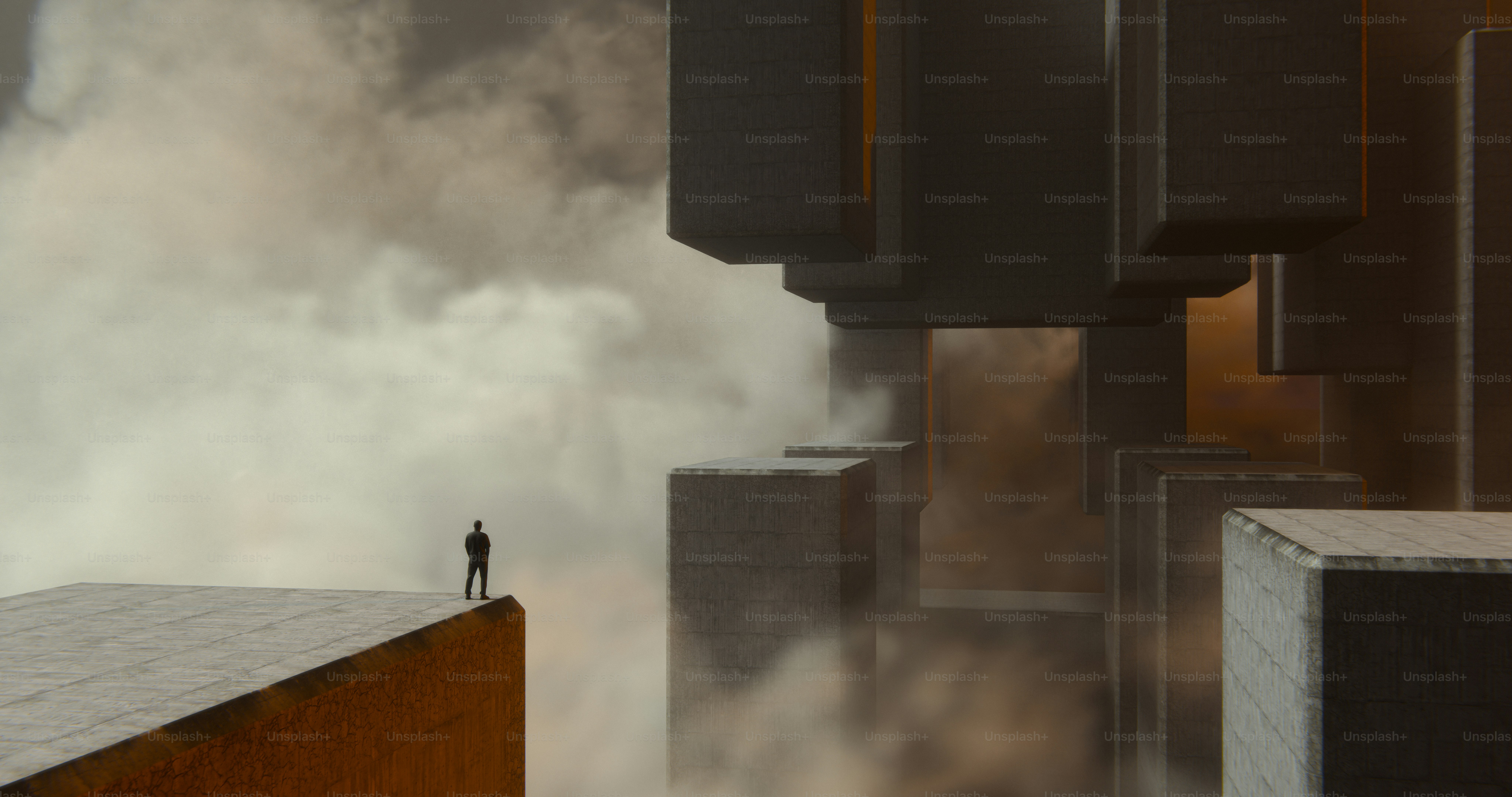 A person on a concrete ledge overlooking massive geometric structures in the clouds