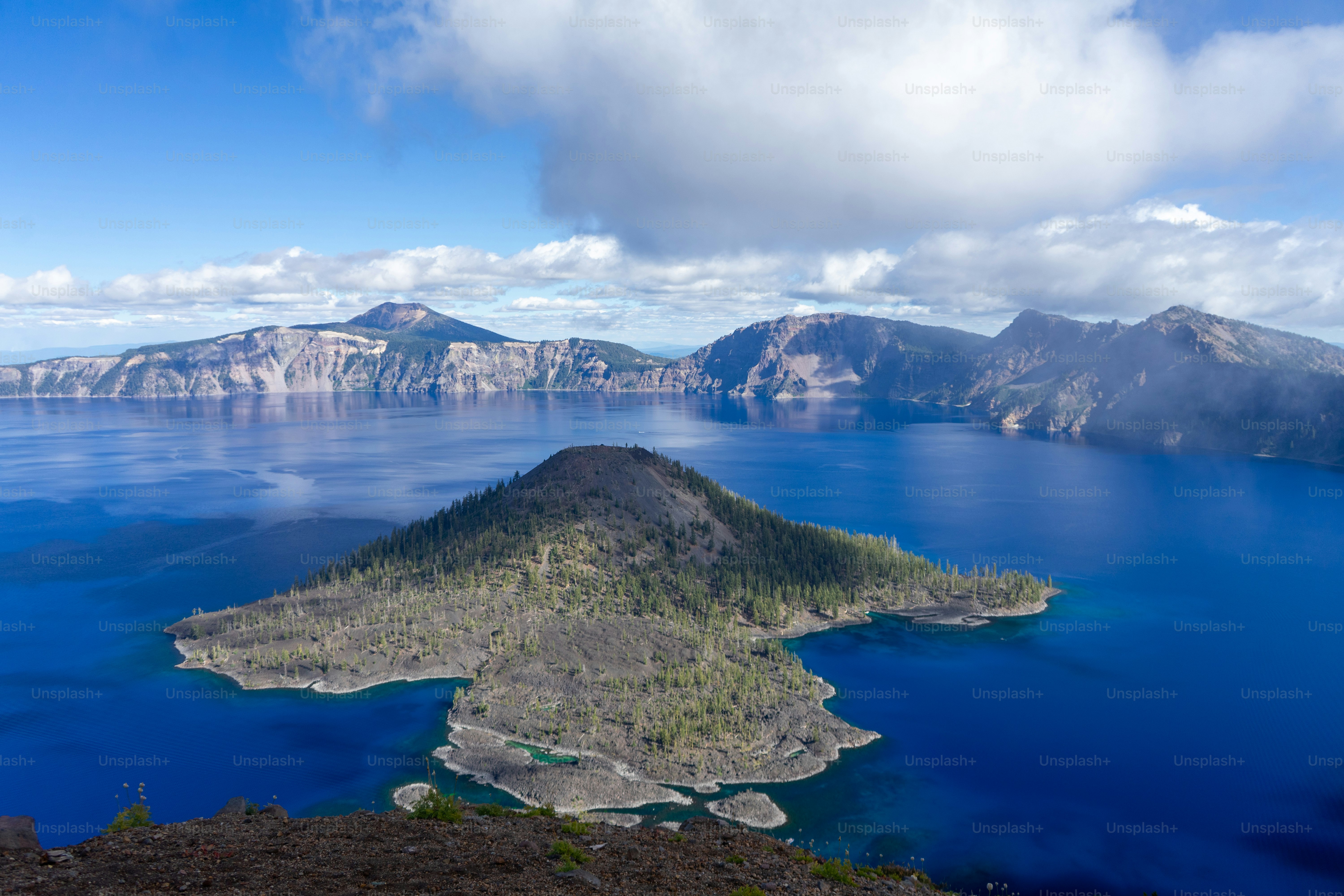 Wizard Island in the deep blue water of Crater Lake in Oregon