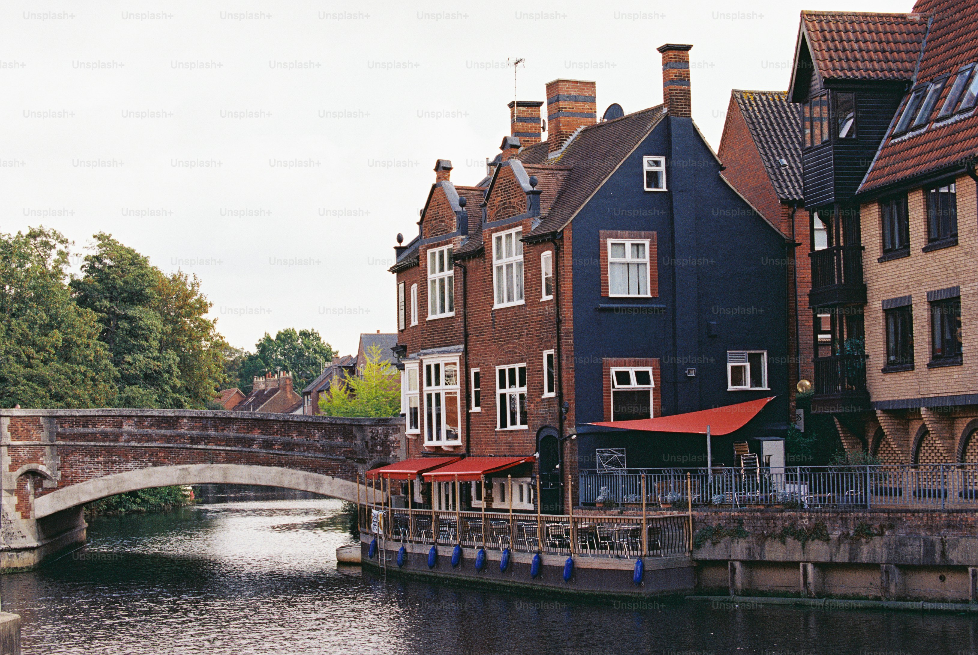 Bridge and riverside buildings in Norwich - Photo on Unsplash+