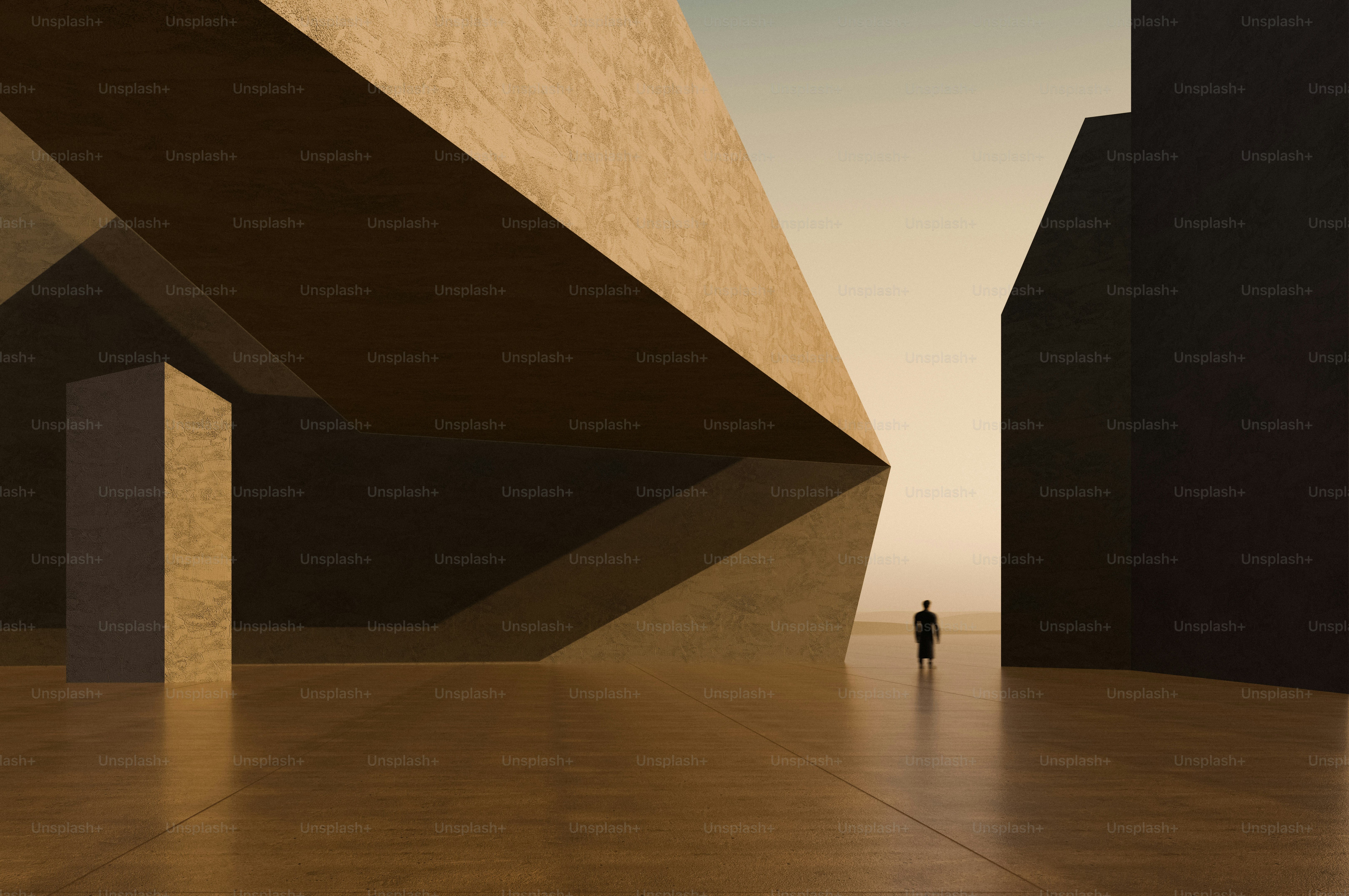 A person in silhouette against a warm sky between large geometric concrete structures