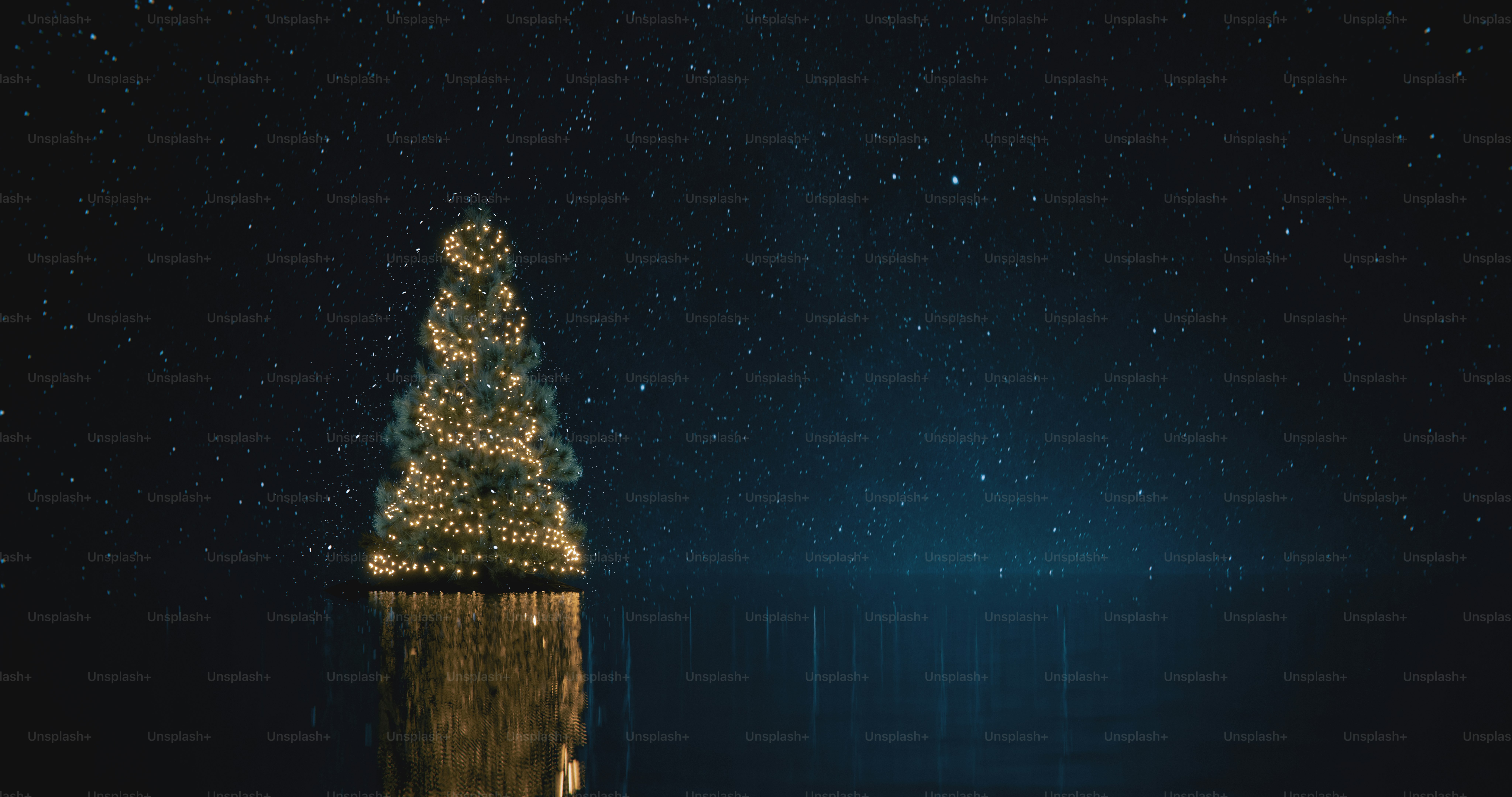 A glowing Christmas tree reflected in dark water under a starry night sky