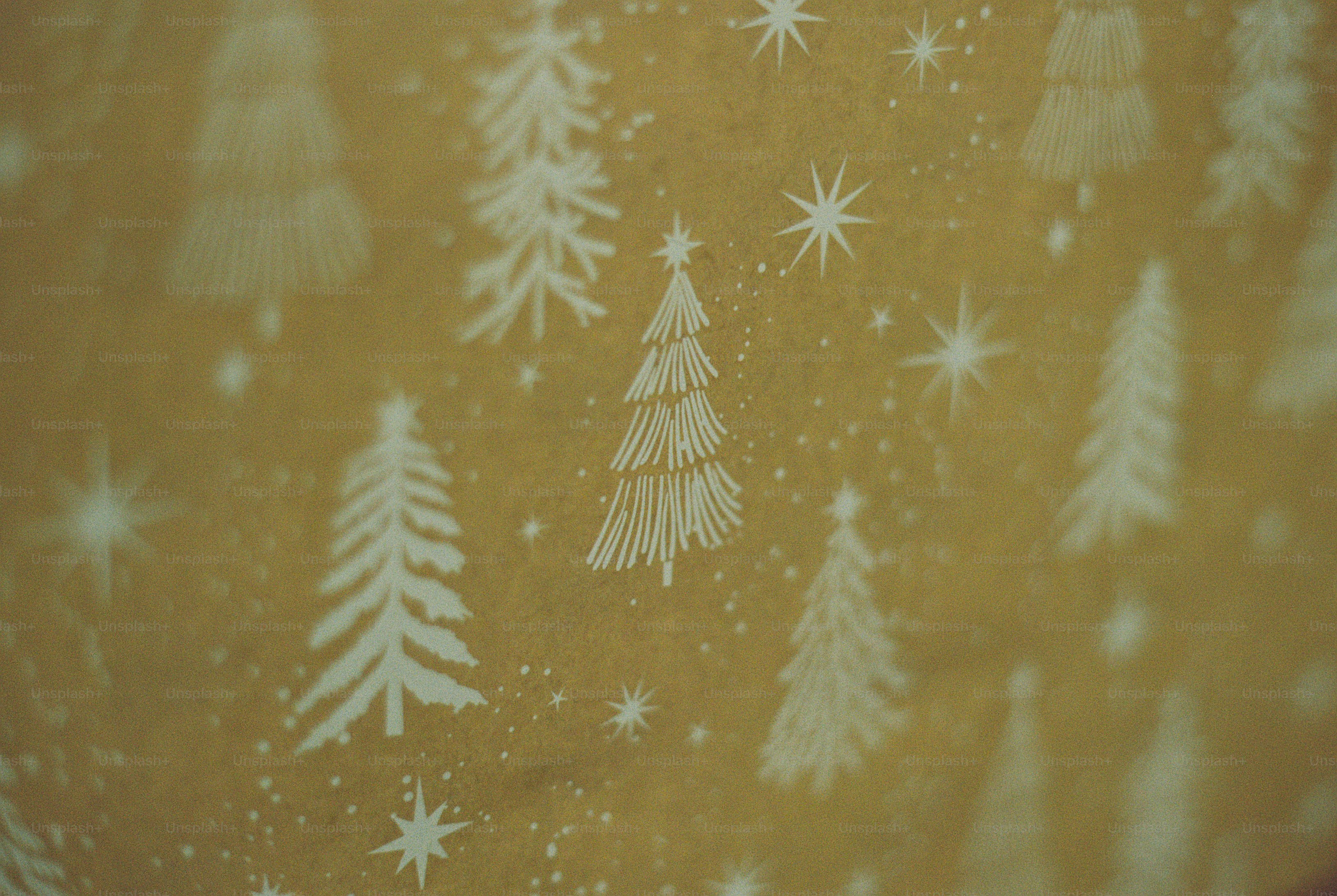 White pine trees and eight-pointed stars printed on mustard-brown paper with tiny dots