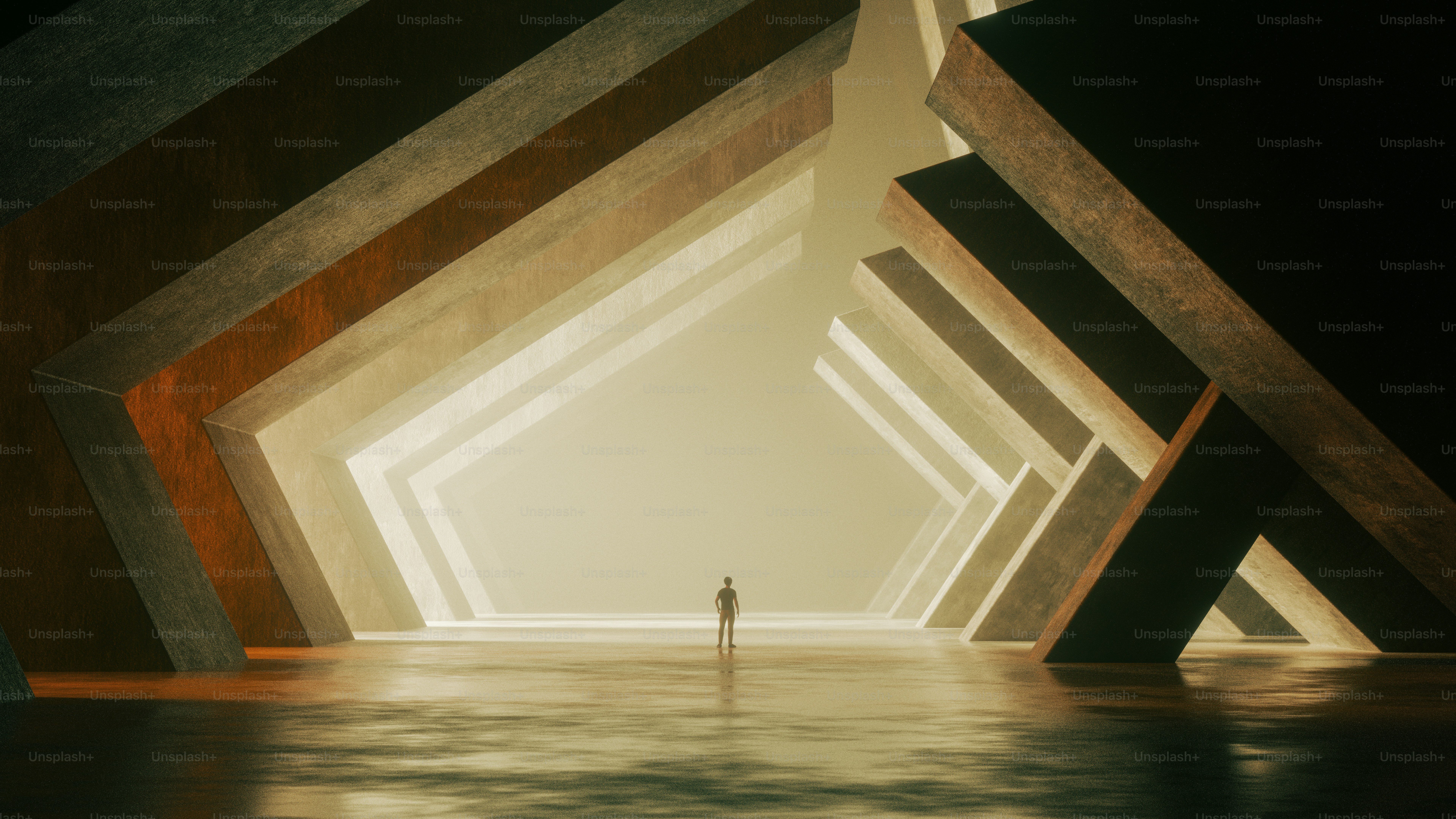 A person in silhouette within a vast hall of angular concrete structures