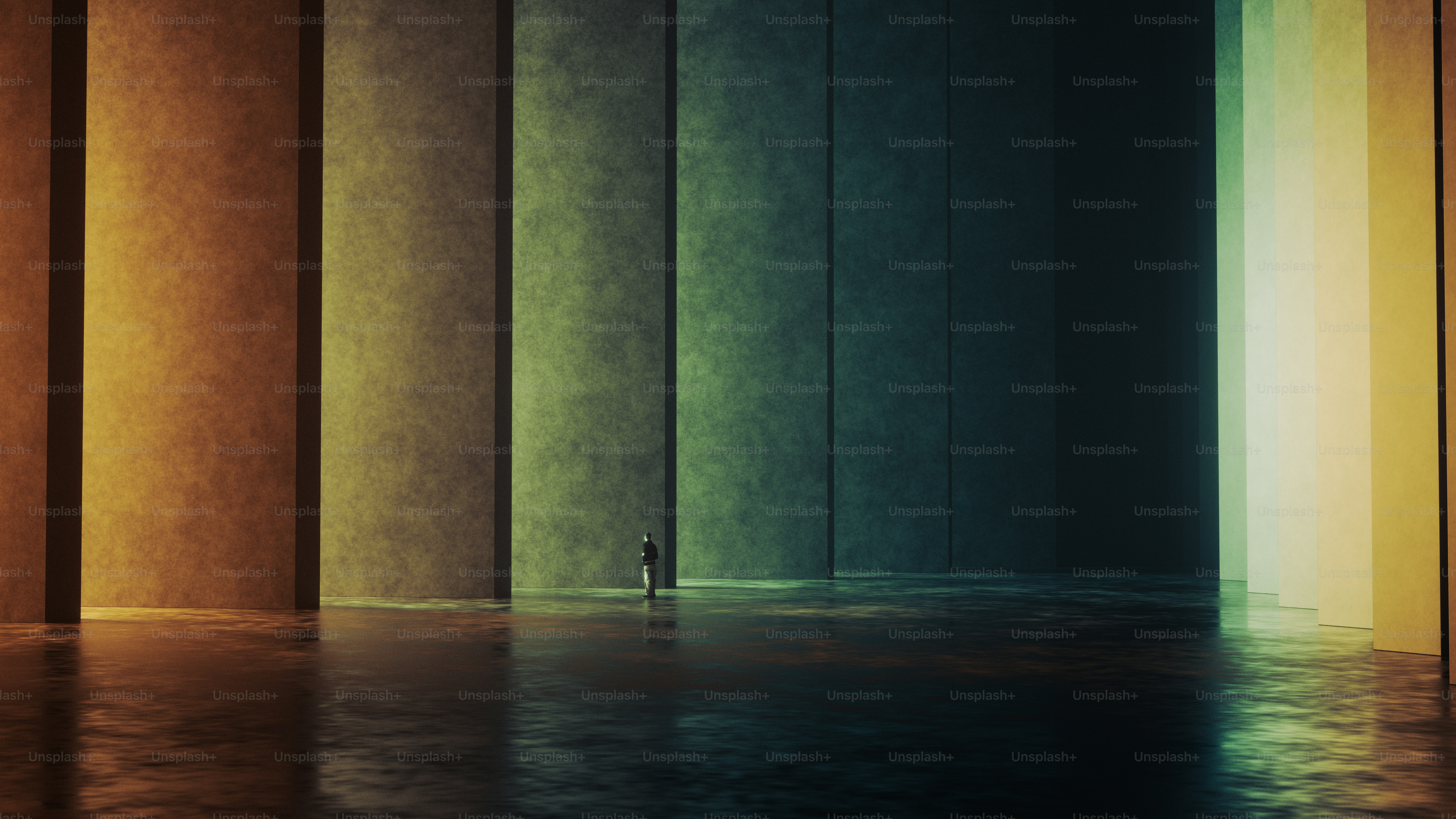 A person standing in a vast hall with tall colorful illuminated panels