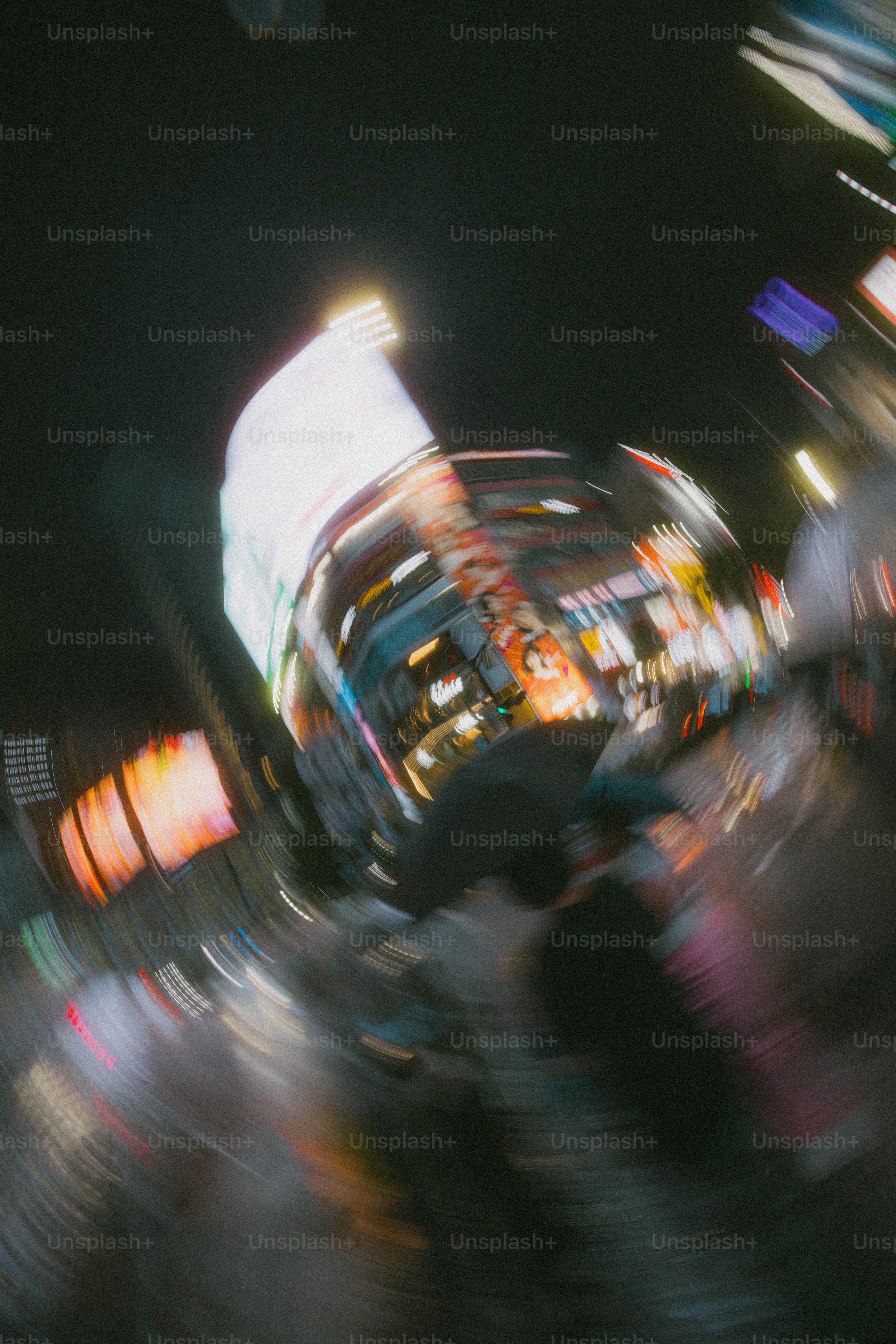 Person with umbrella in blurred Shibuya - Photo on Unsplash+