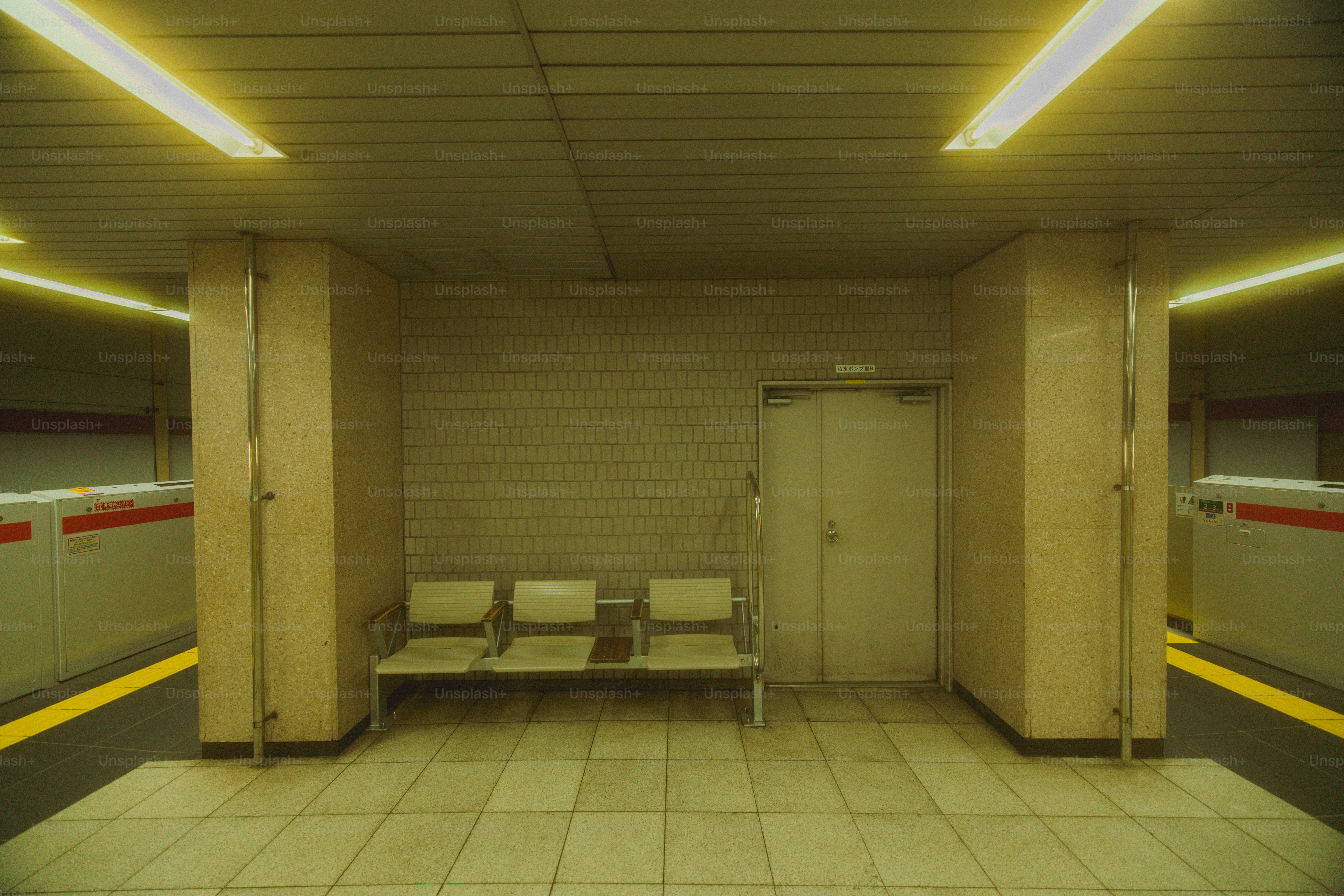 Empty chairs in subway station - Photo on Unsplash+