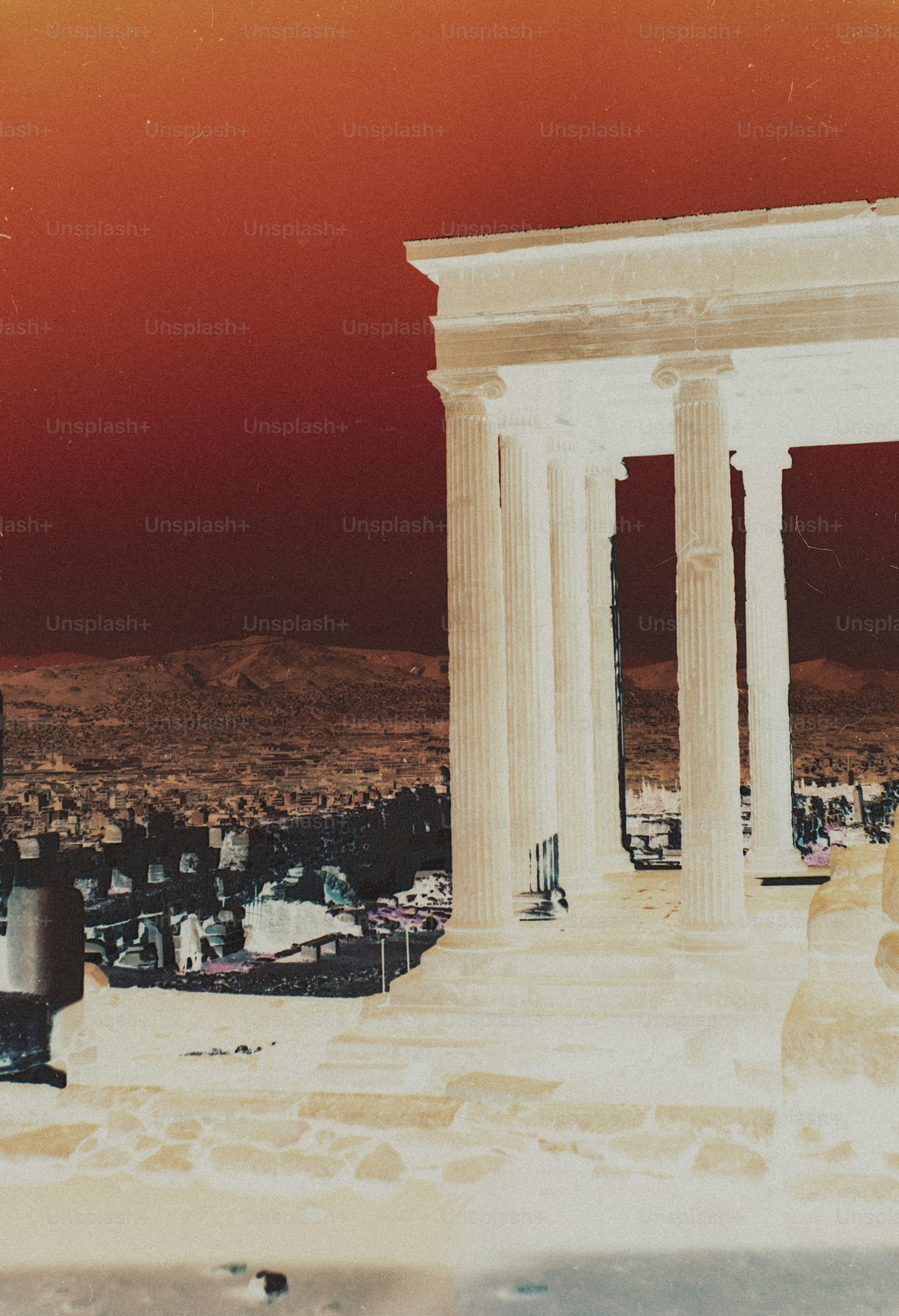 An inverted color view of the Parthenon columns overlooking the city of Athens