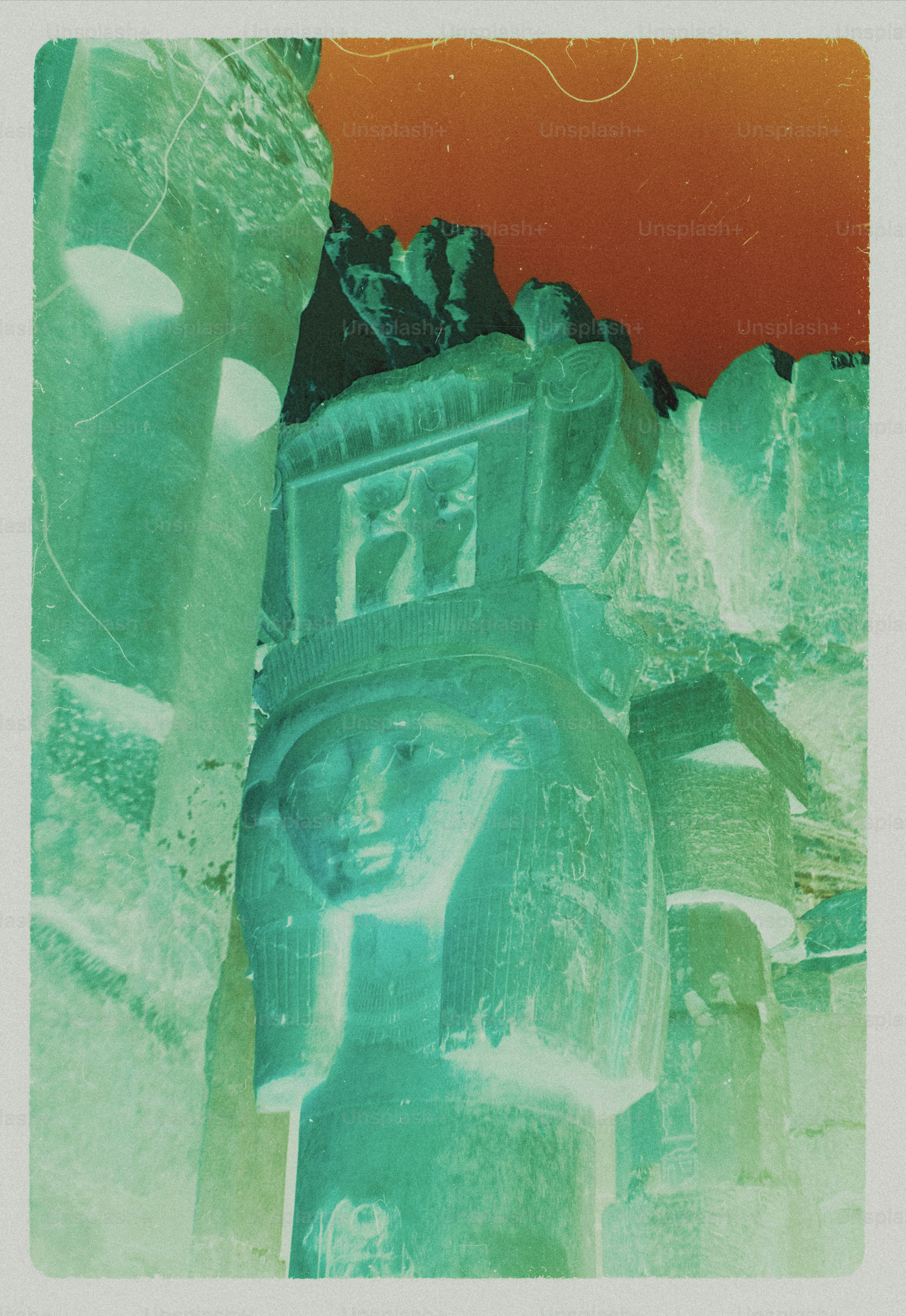 An inverted color view of an ancient Egyptian stone column with a carved face