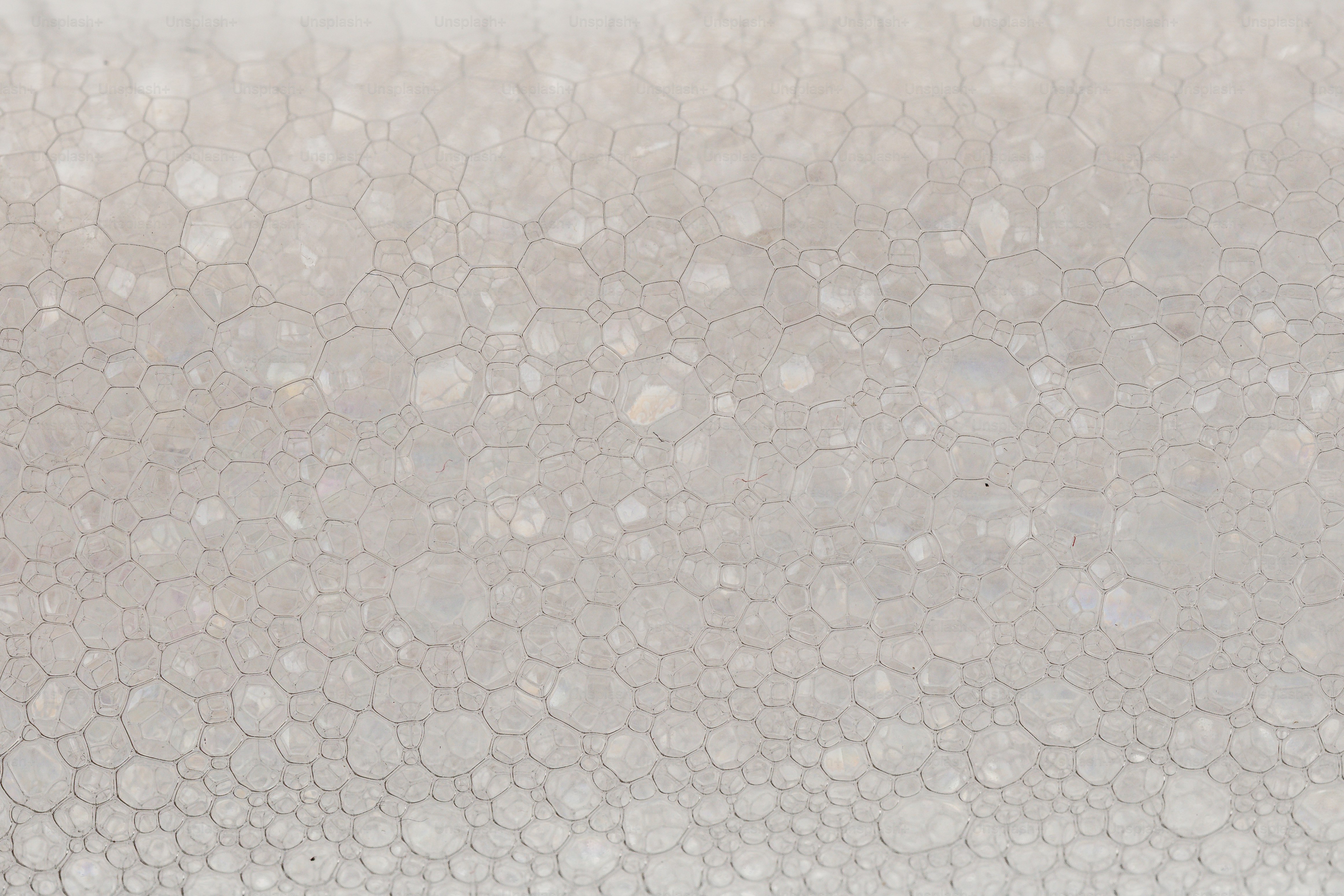 White soap bubbles honeycomb pattern - Photo on Unsplash+