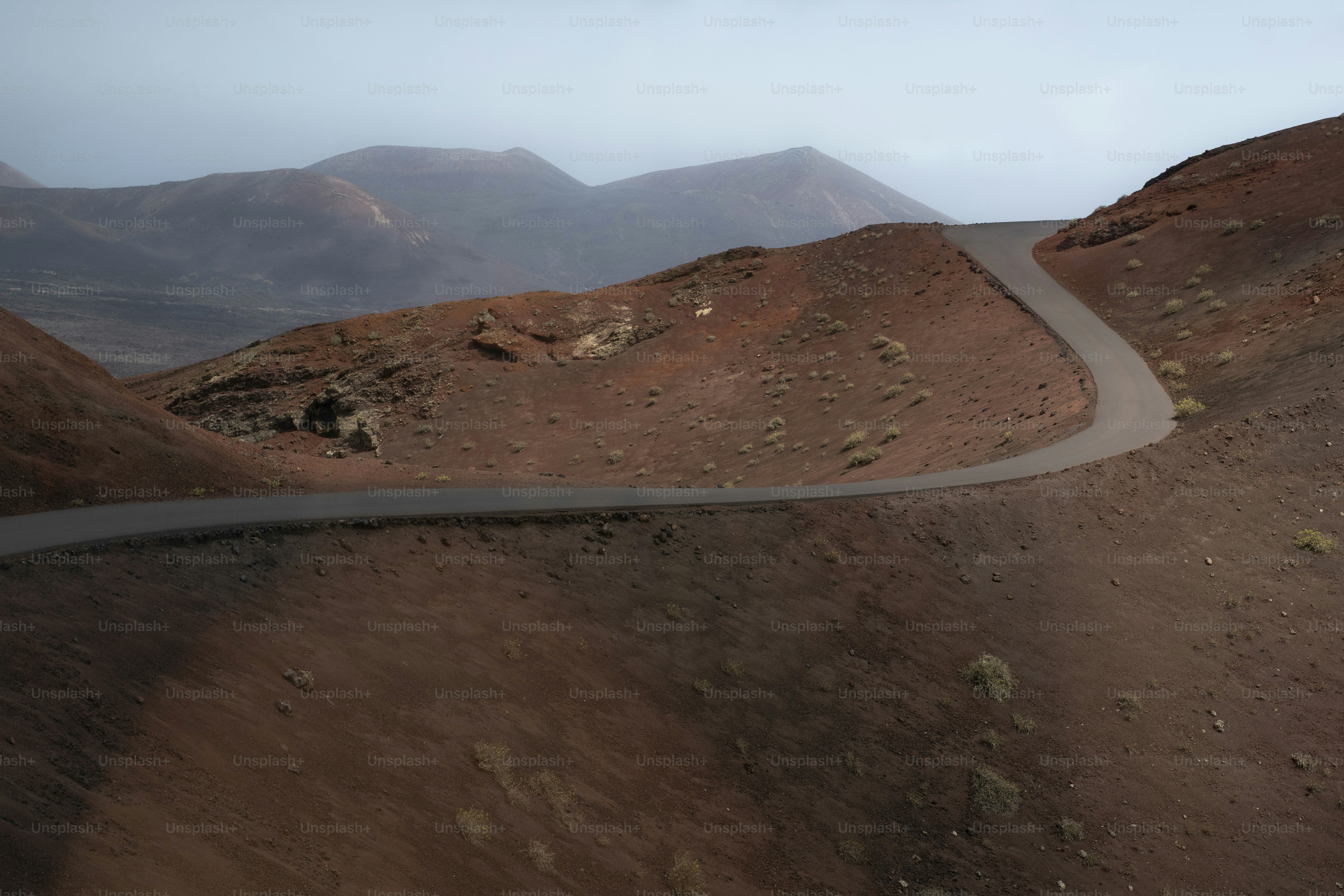Winding road through volcanic landscape - Photo on Unsplash+
