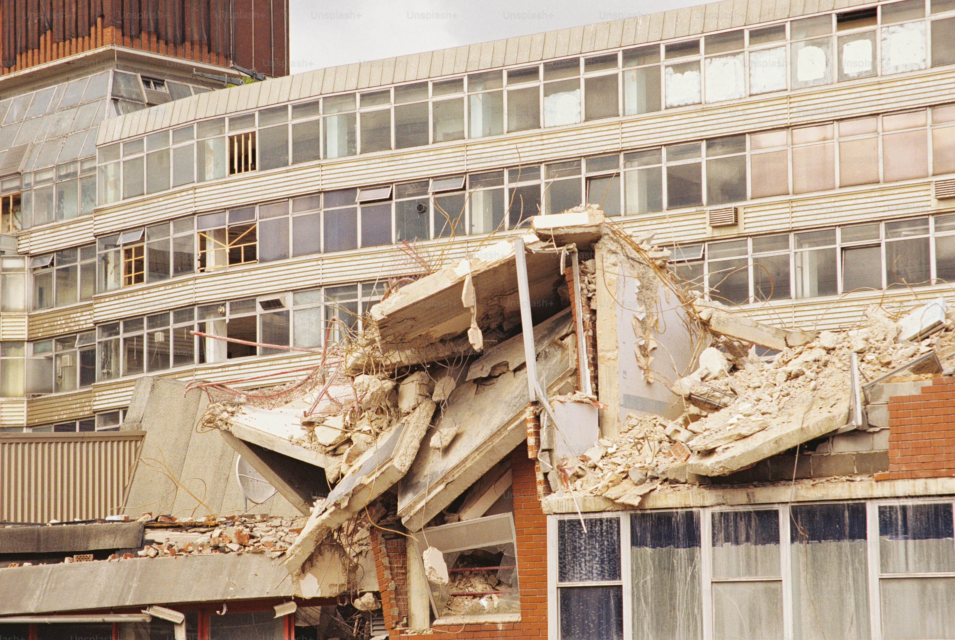 Damaged concrete canopy and steel beams - Photo on Unsplash+