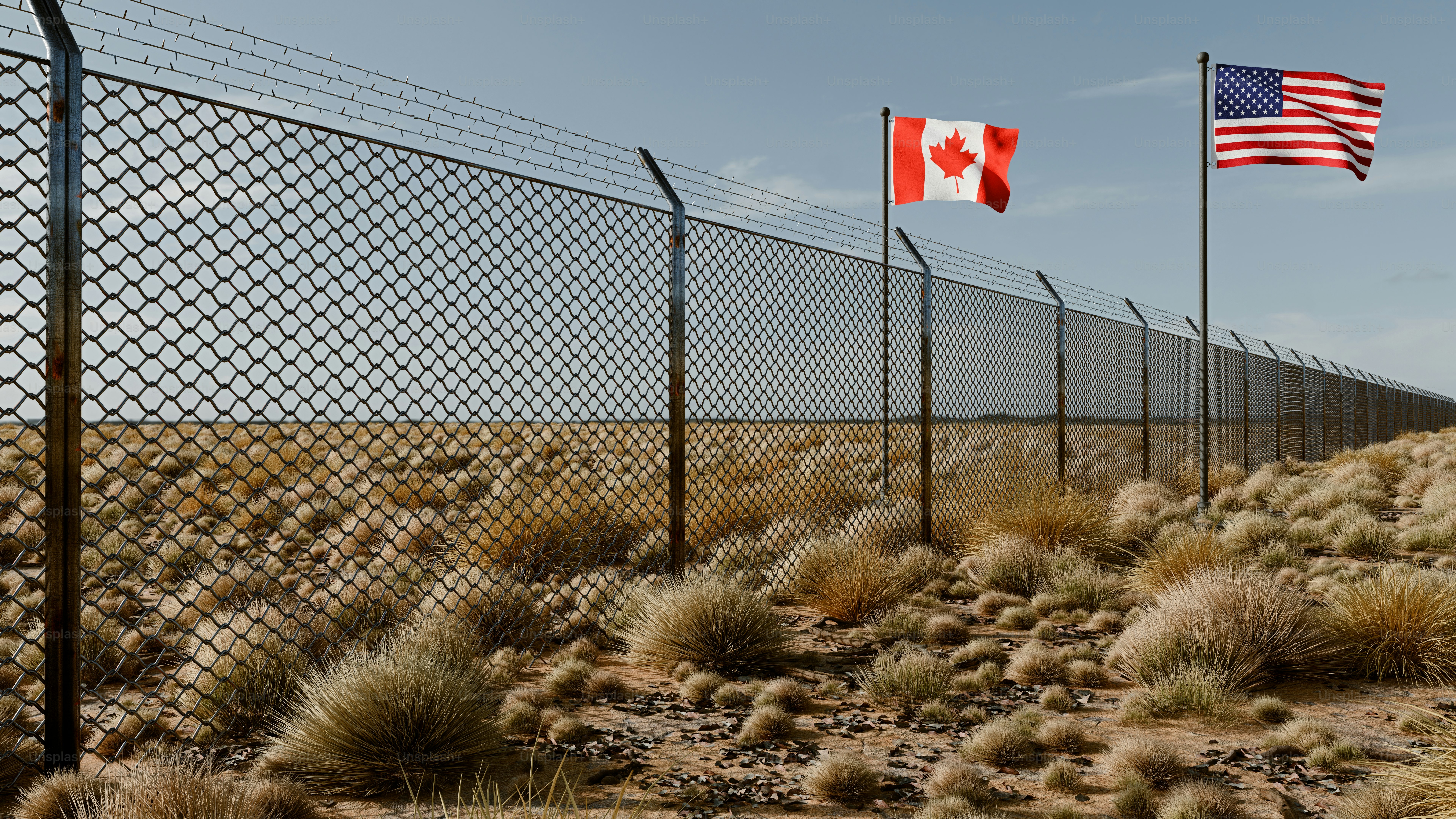 A 3D render of the Canadian and American flags flying over a chain-link fence in a desert landscape