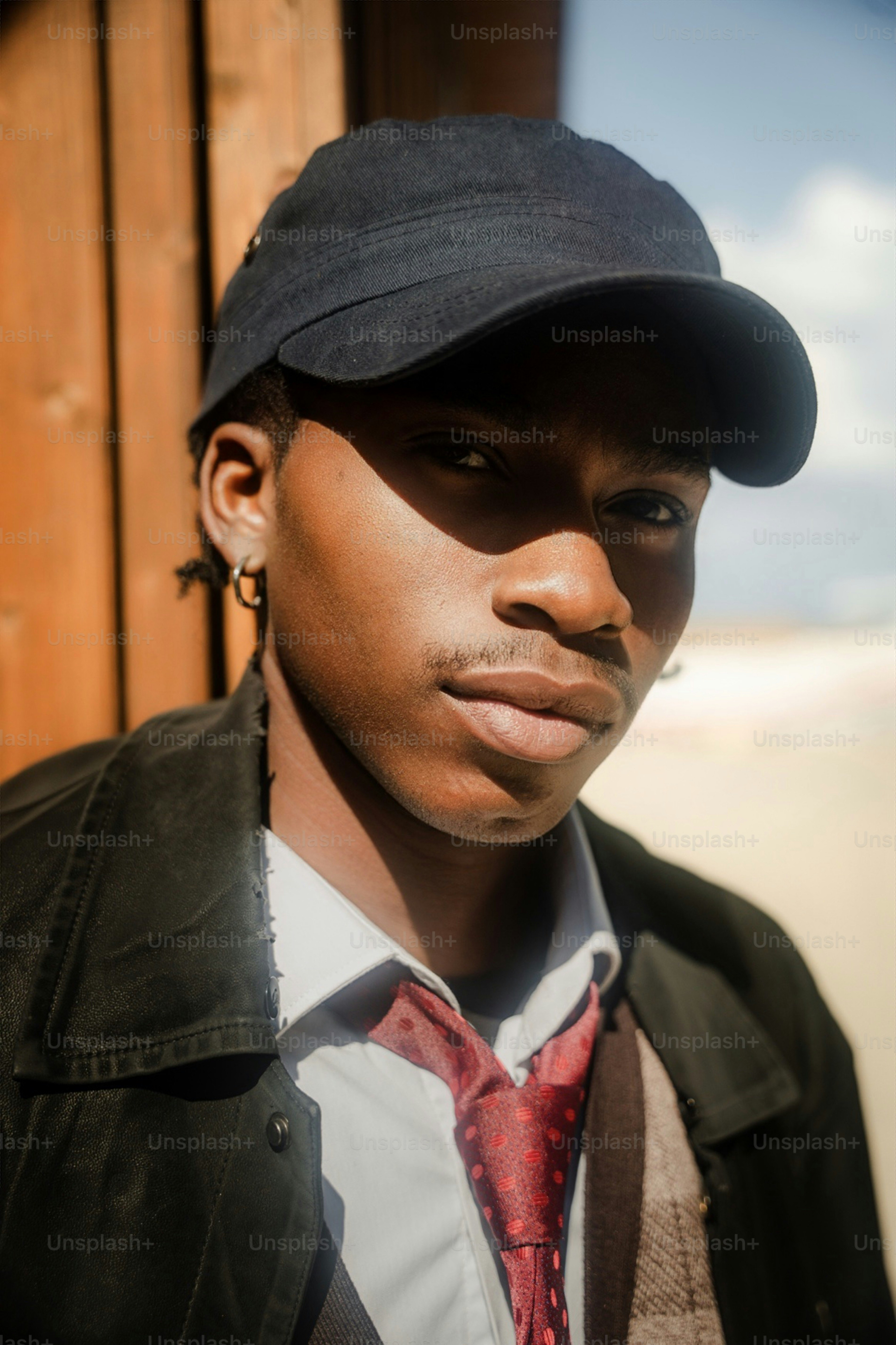 Young man in brown jacket - Photo on Unsplash+