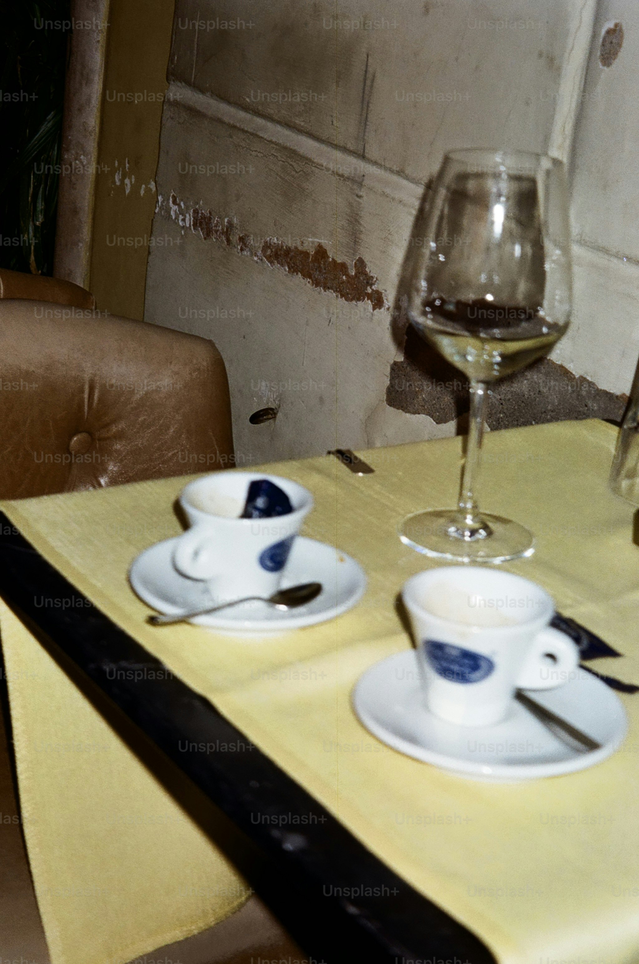 Espresso cups and wine glass - Photo on Unsplash+