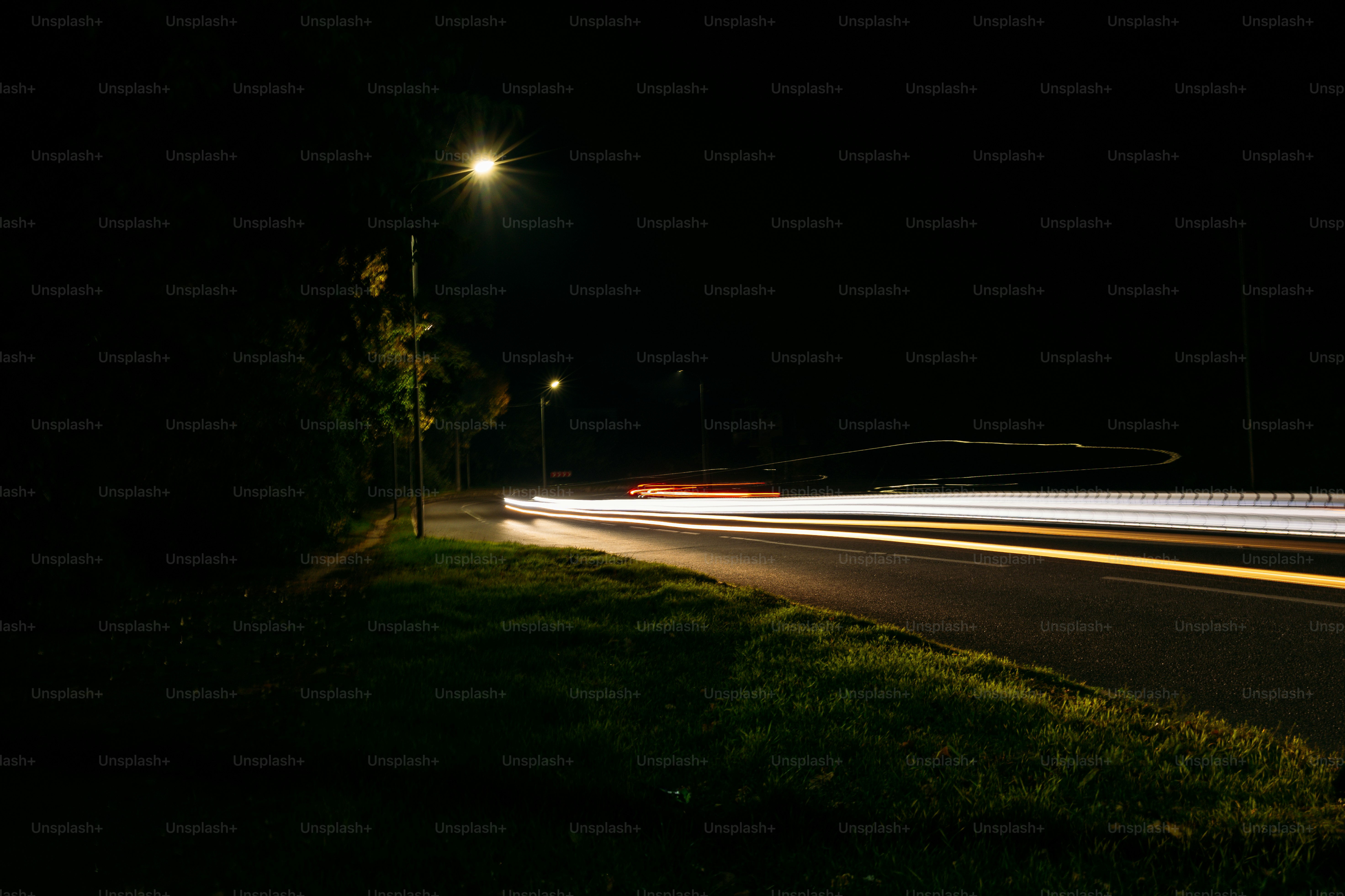 Long exposure light trails on road - Photo on Unsplash+
