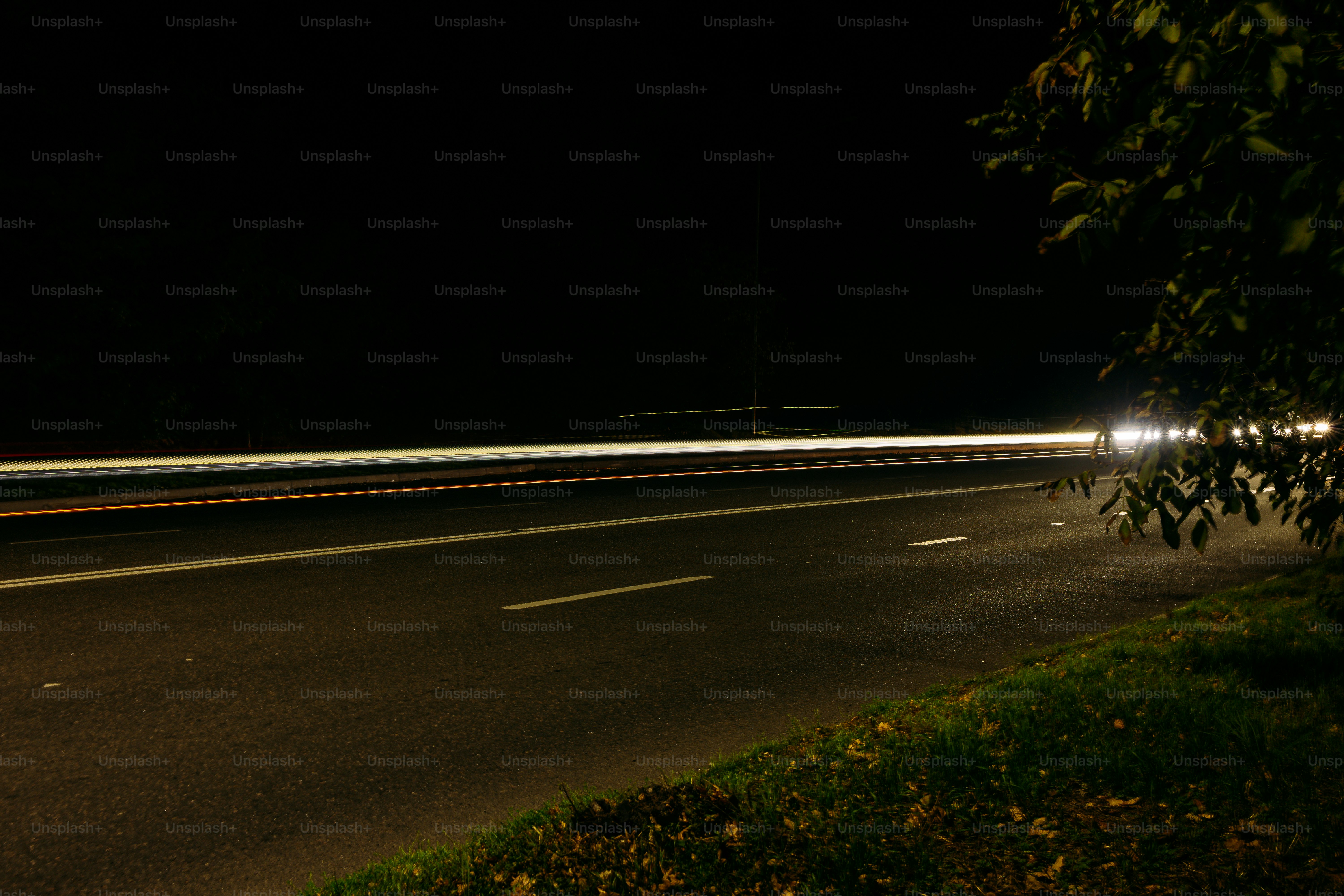 Long exposure light trails on road - Photo on Unsplash+