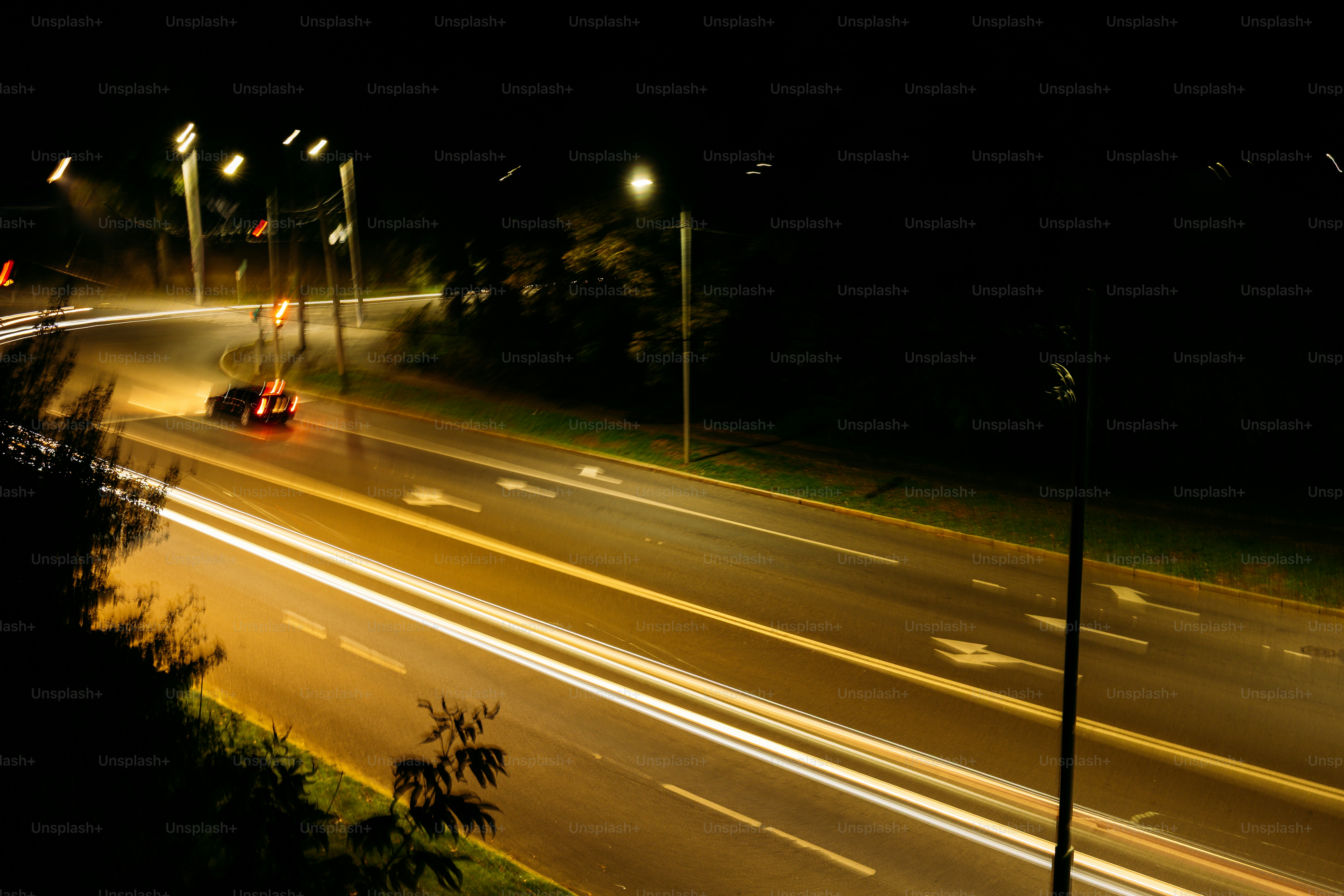 Long exposure light trails on road - Photo on Unsplash+
