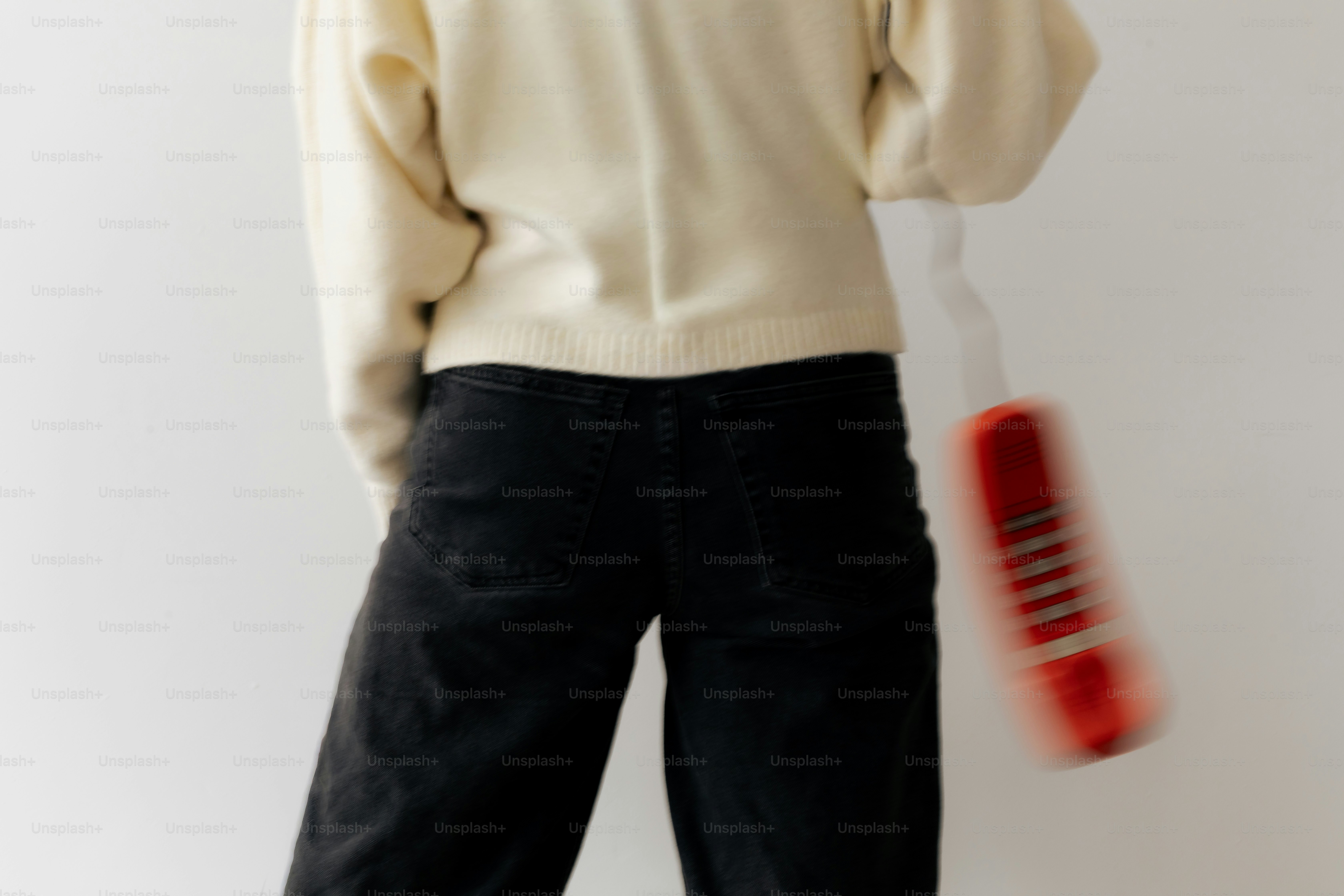 Person with red landline telephone - Photo on Unsplash+