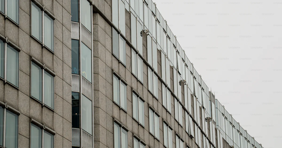 Stone Cladding Under Window Modern office building with stone facade - Photo on Unsplash+