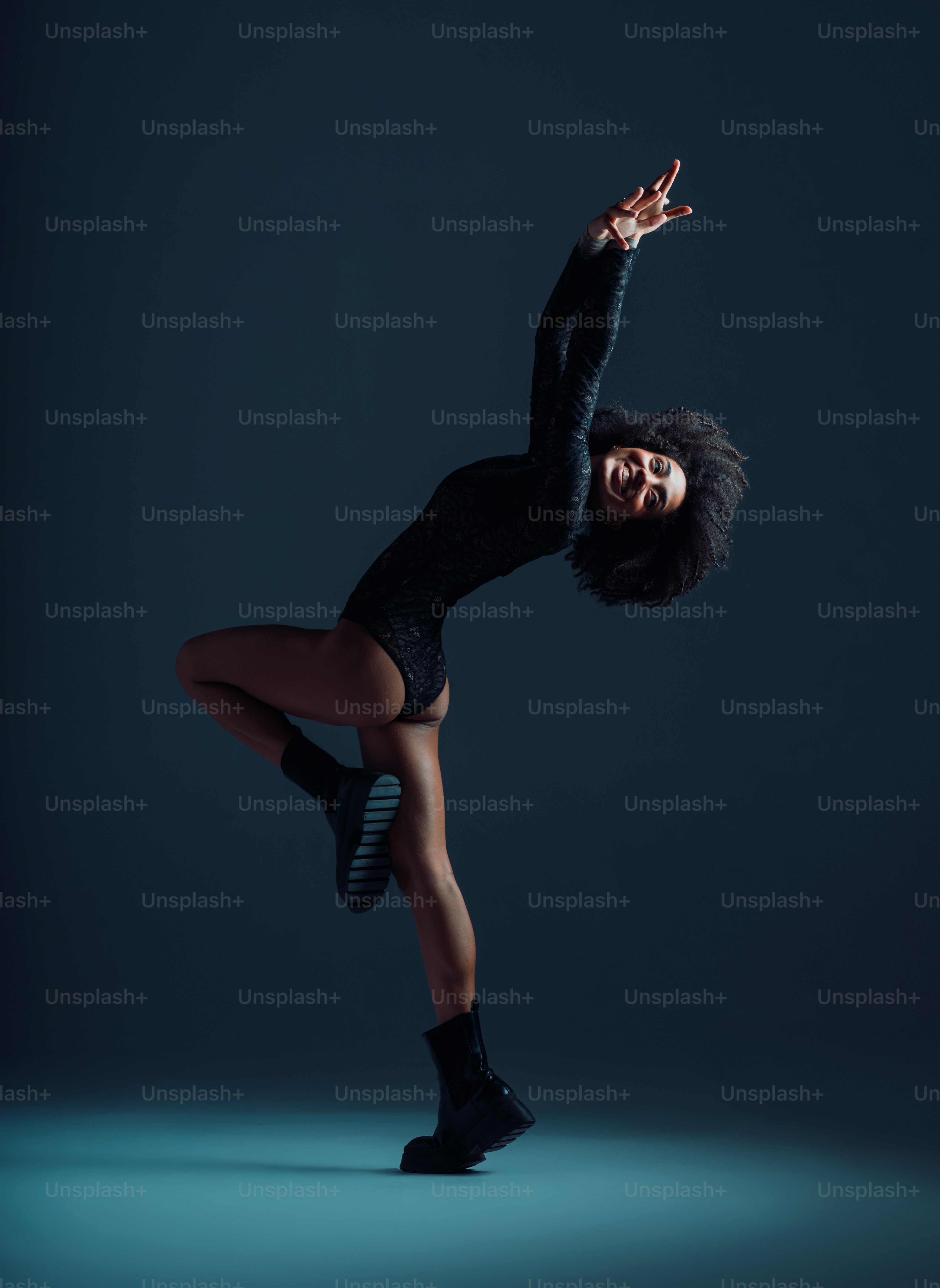 Woman in black outfit posing - Photo on Unsplash+