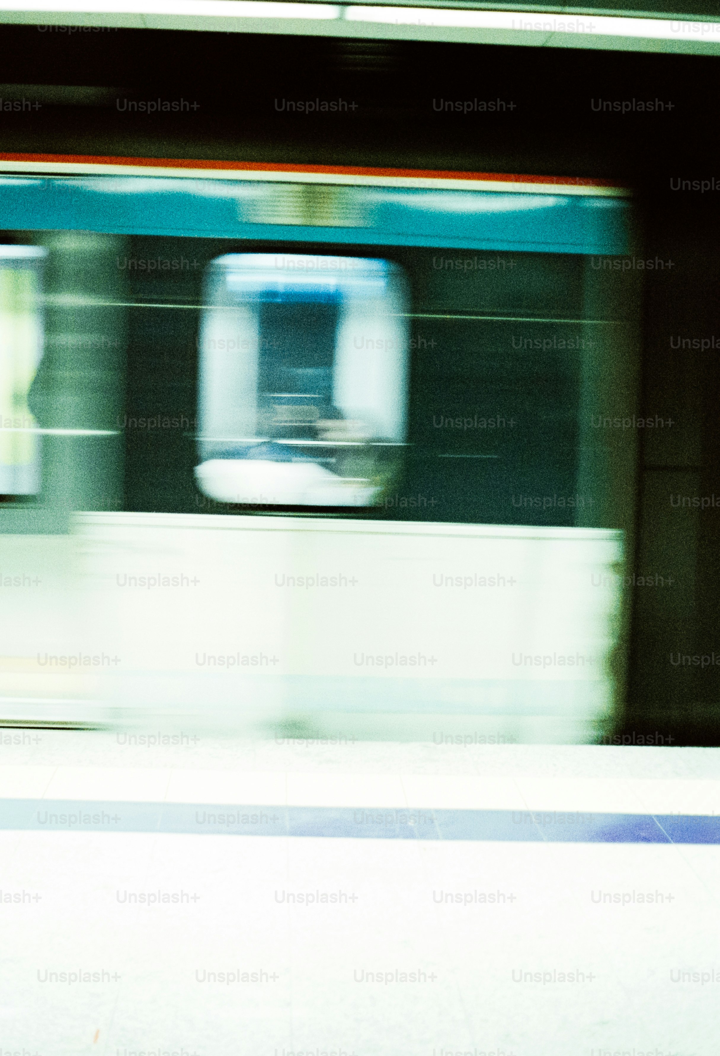 Motion-blurred subway train at station - Photo on Unsplash+