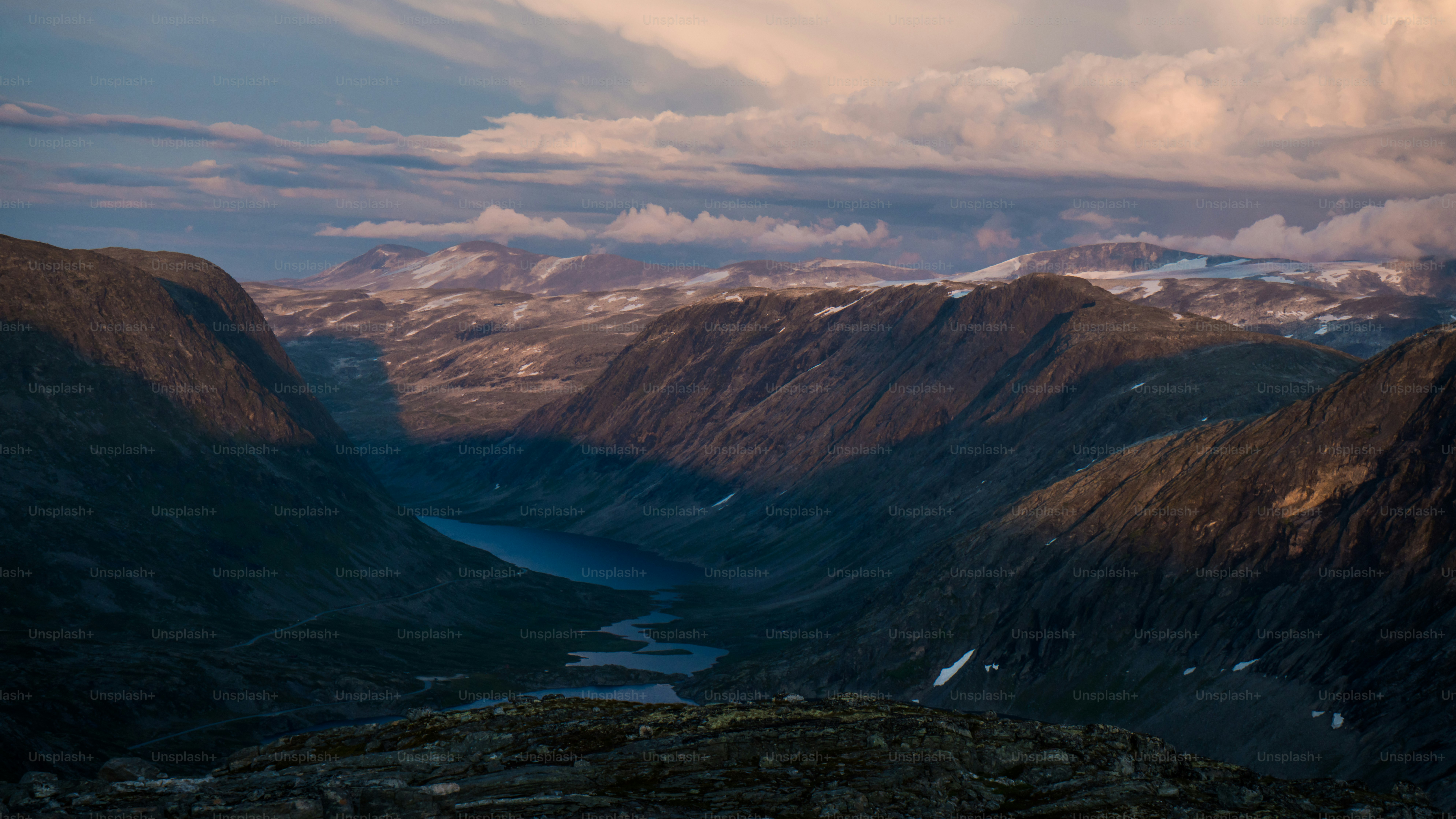 Mountain valley with river at golden hour - Photo on Unsplash+