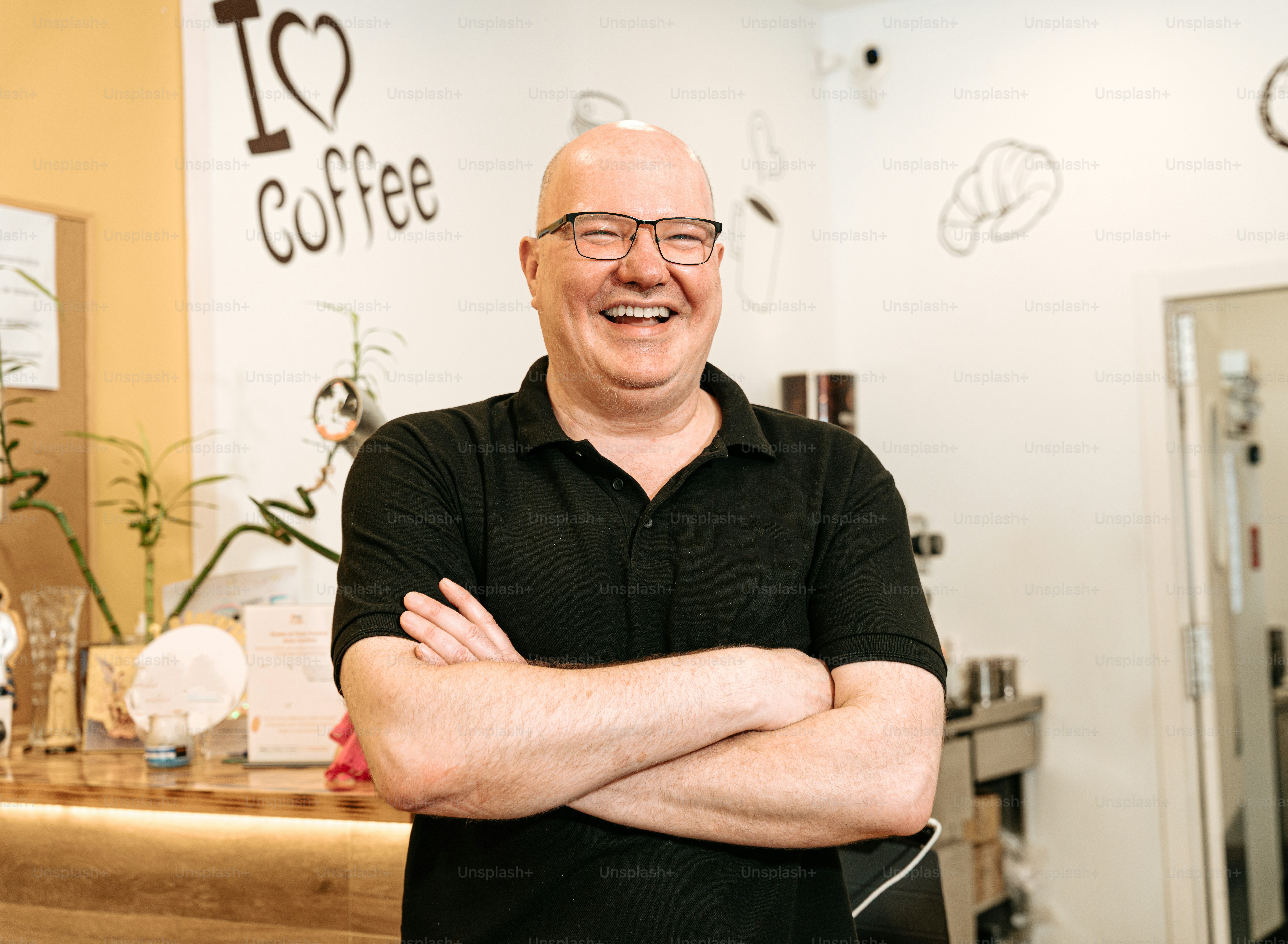Smiling man in black polo shirt - Photo on Unsplash+