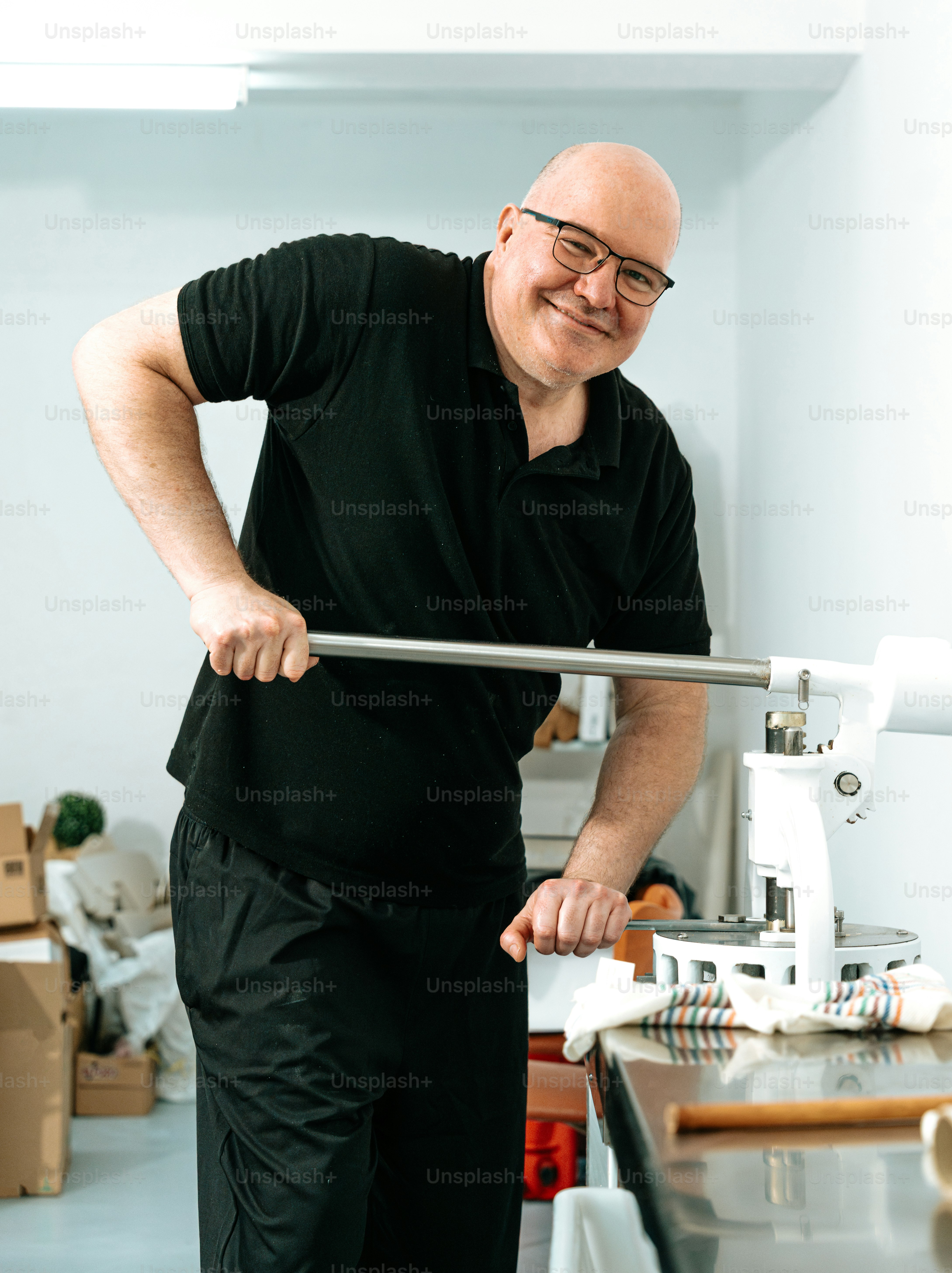 Man operating manual button press - Photo on Unsplash+
