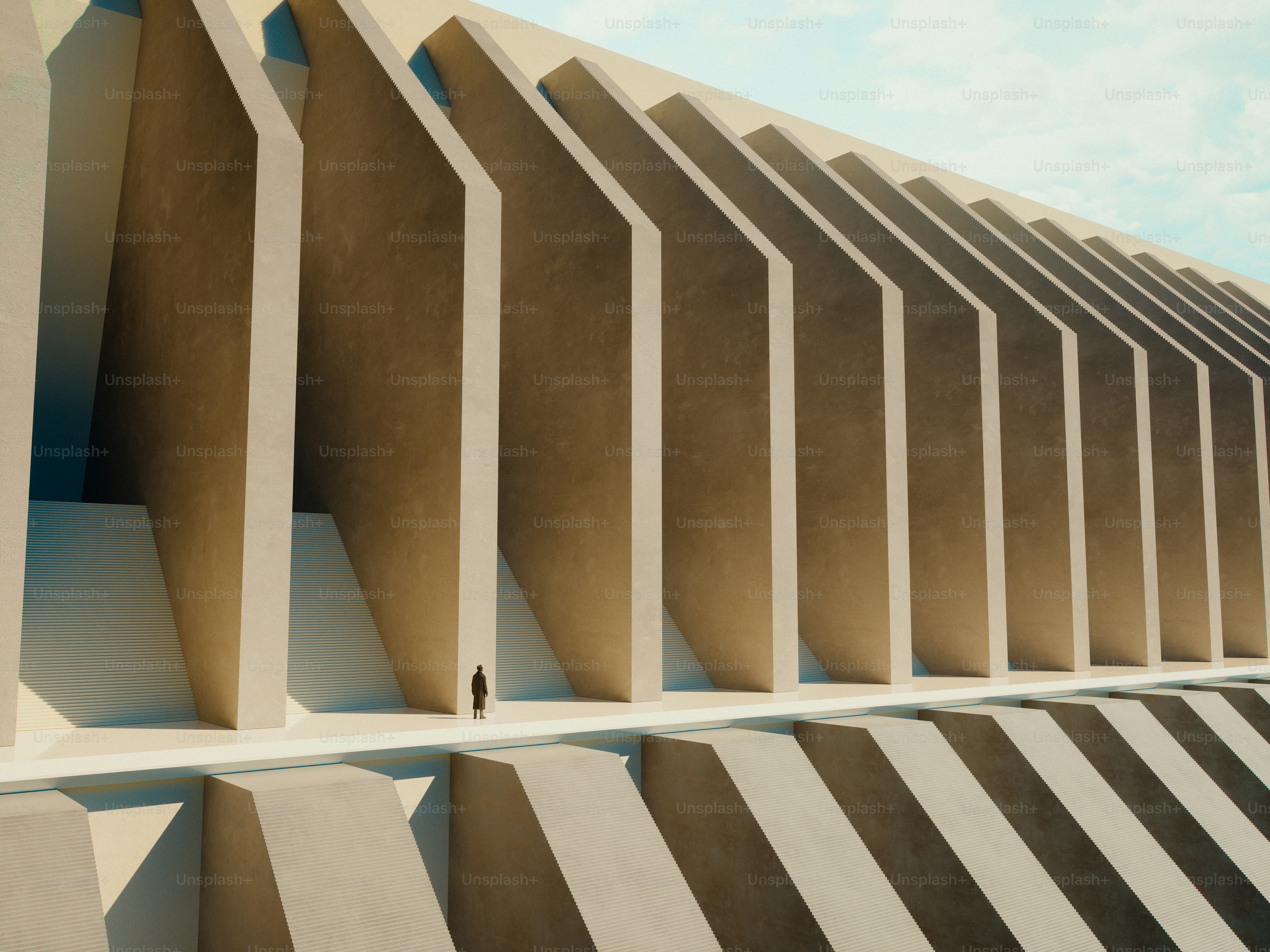 Person on walkway between concrete fins - Photo on Unsplash+