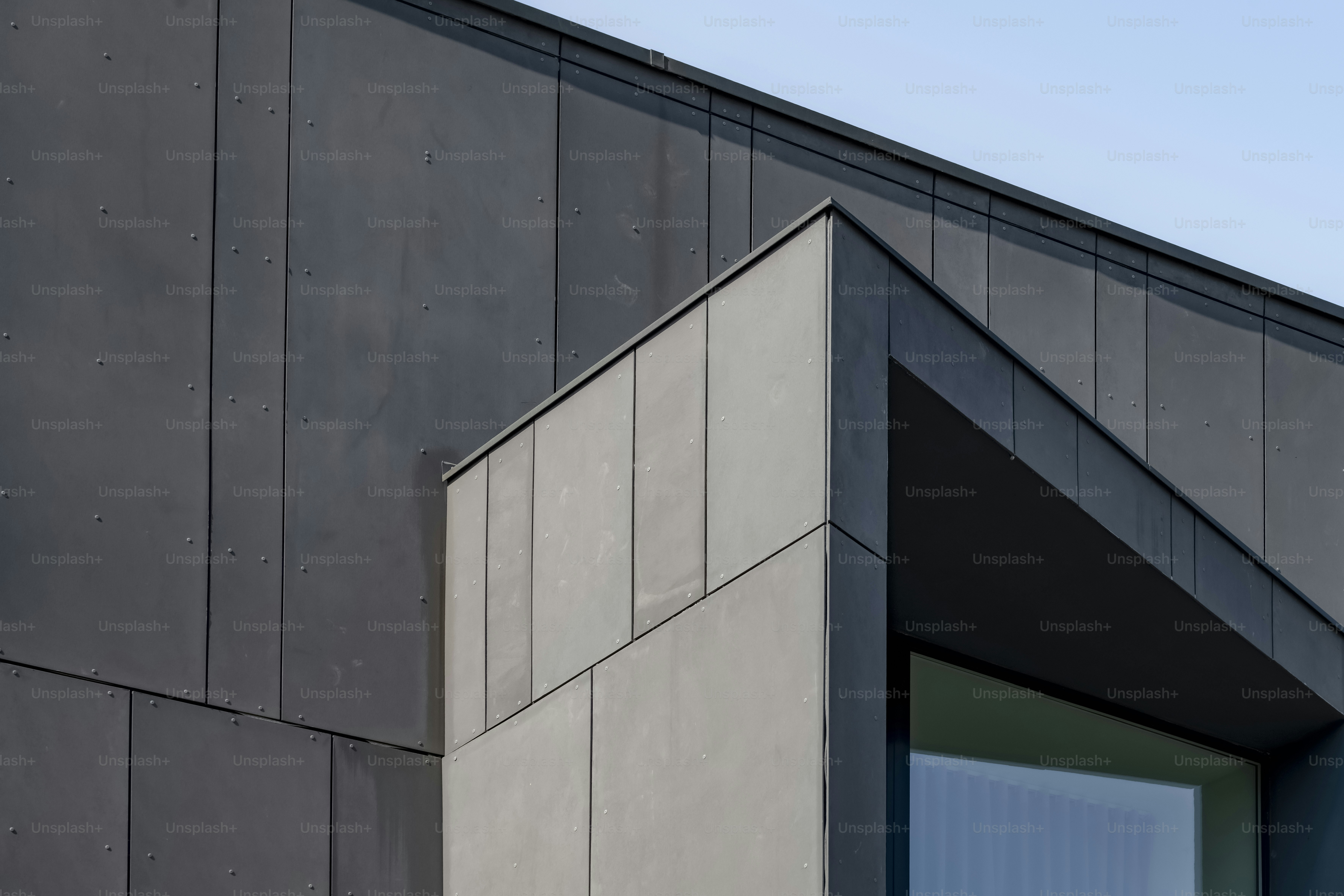 Modern building facade with white panels - Photo on Unsplash+
