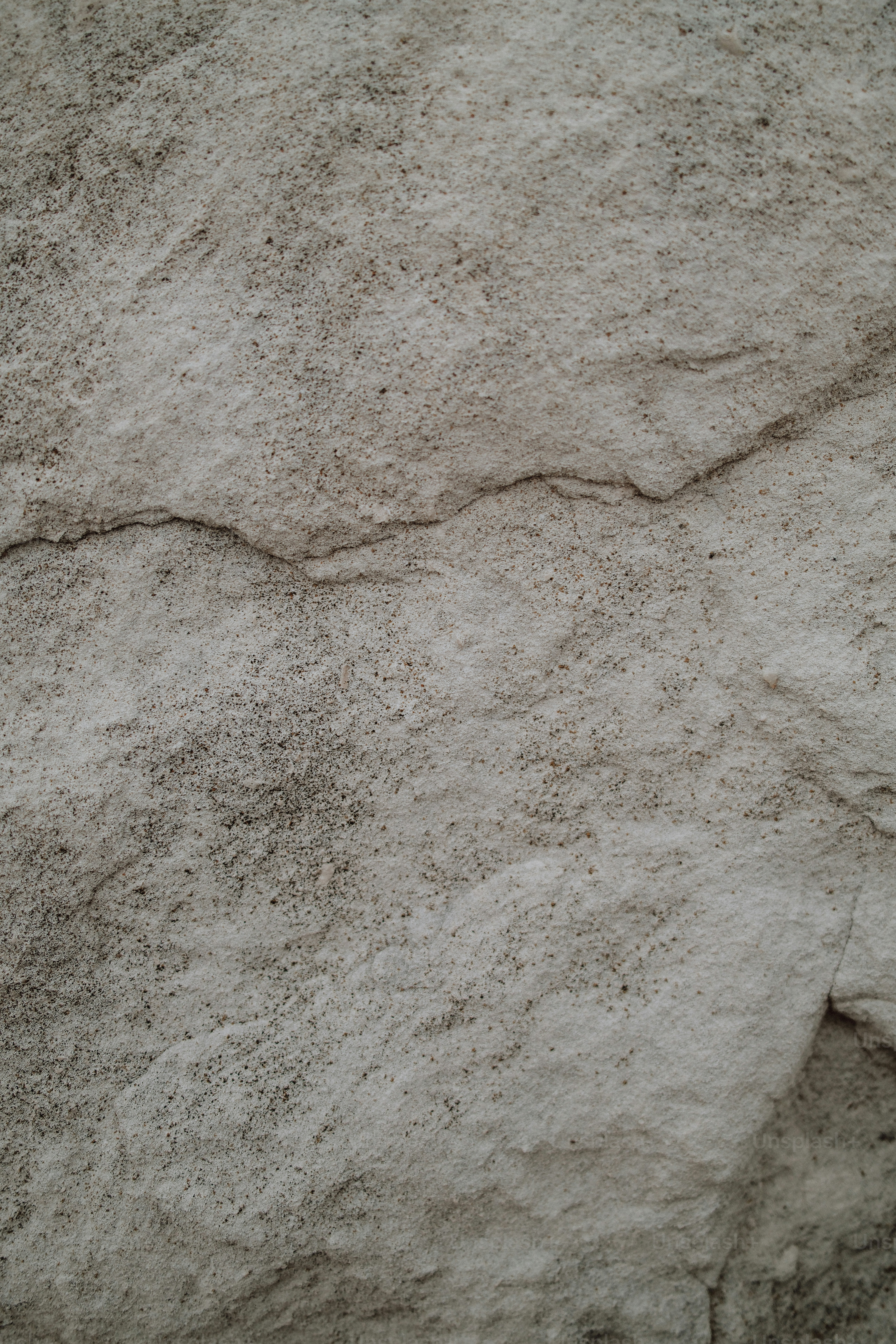 Rough beige stone surface texture - Photo on Unsplash+