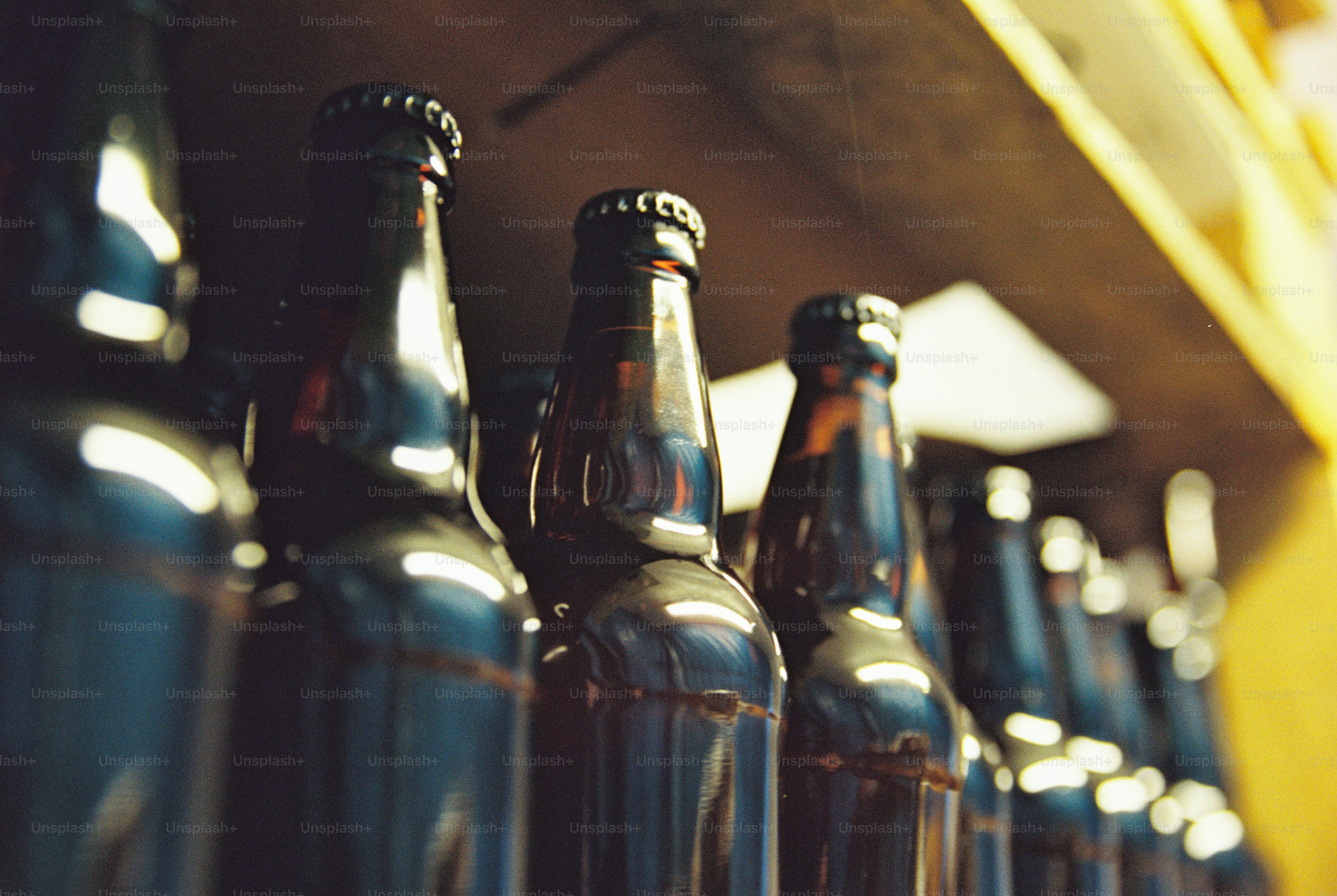 Amber glass bottles on wooden shelf - Photo on Unsplash+