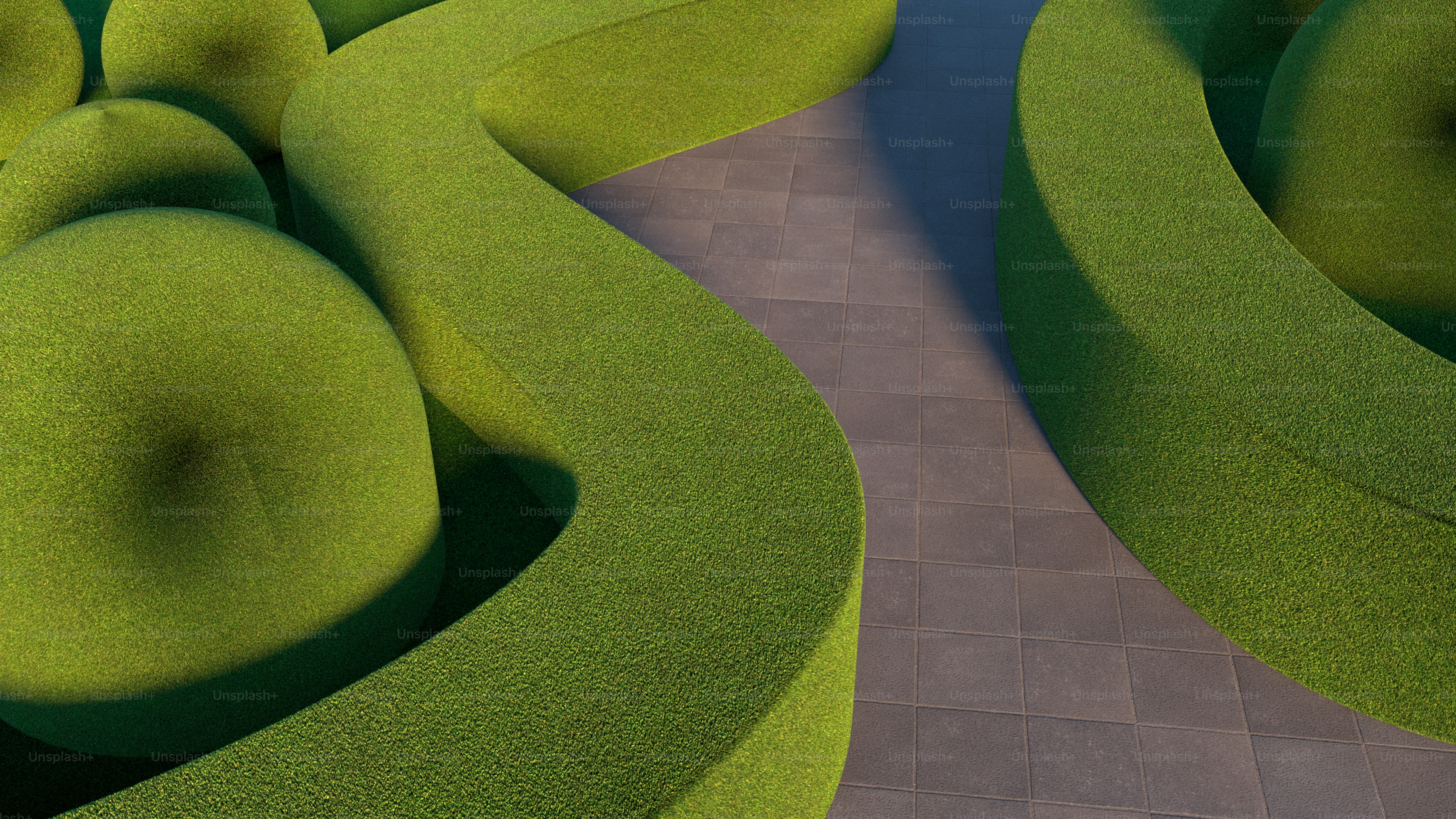 Winding stone path between green hedges - Photo on Unsplash+
