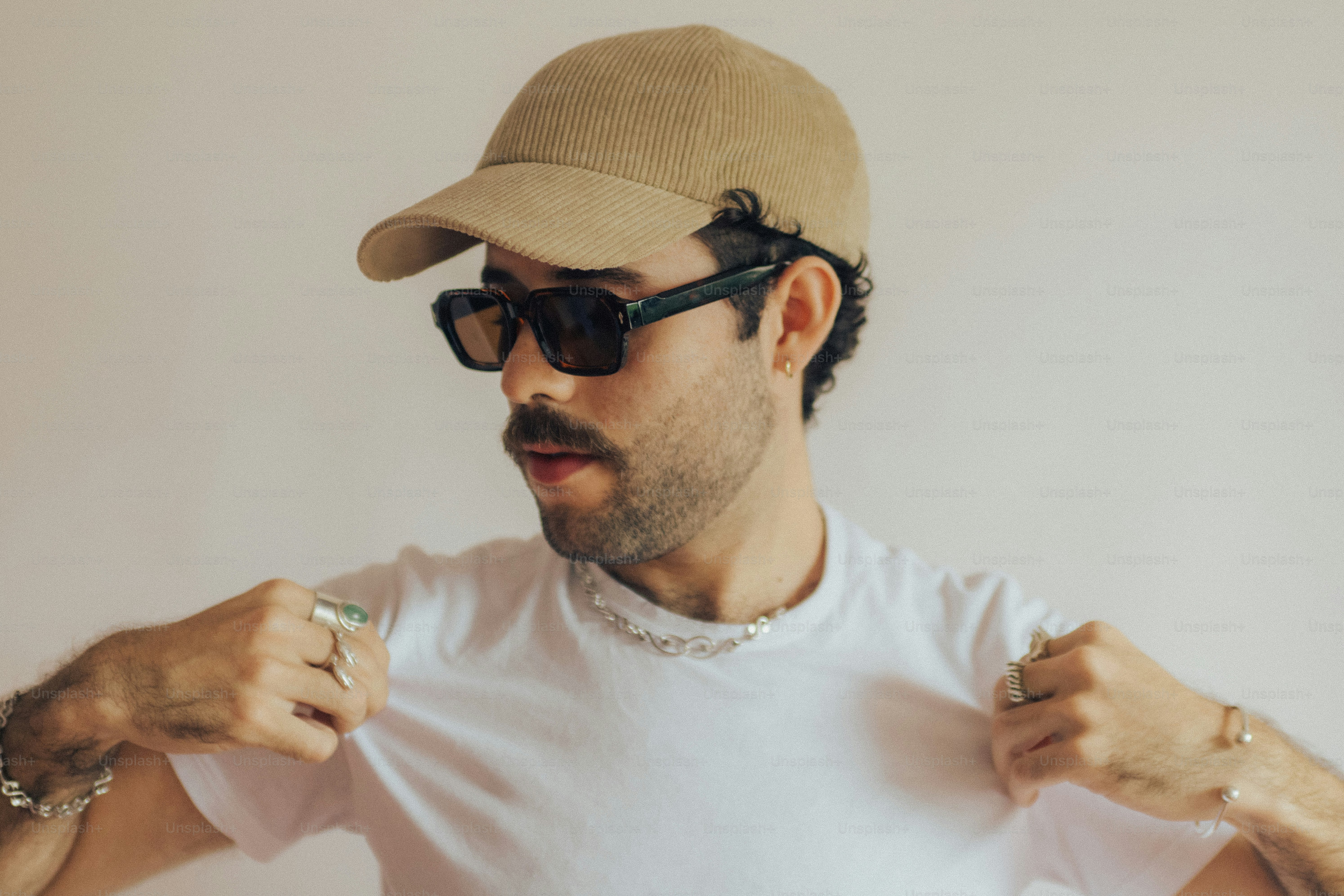 Man with glasses and green shirt - Photo on Unsplash+