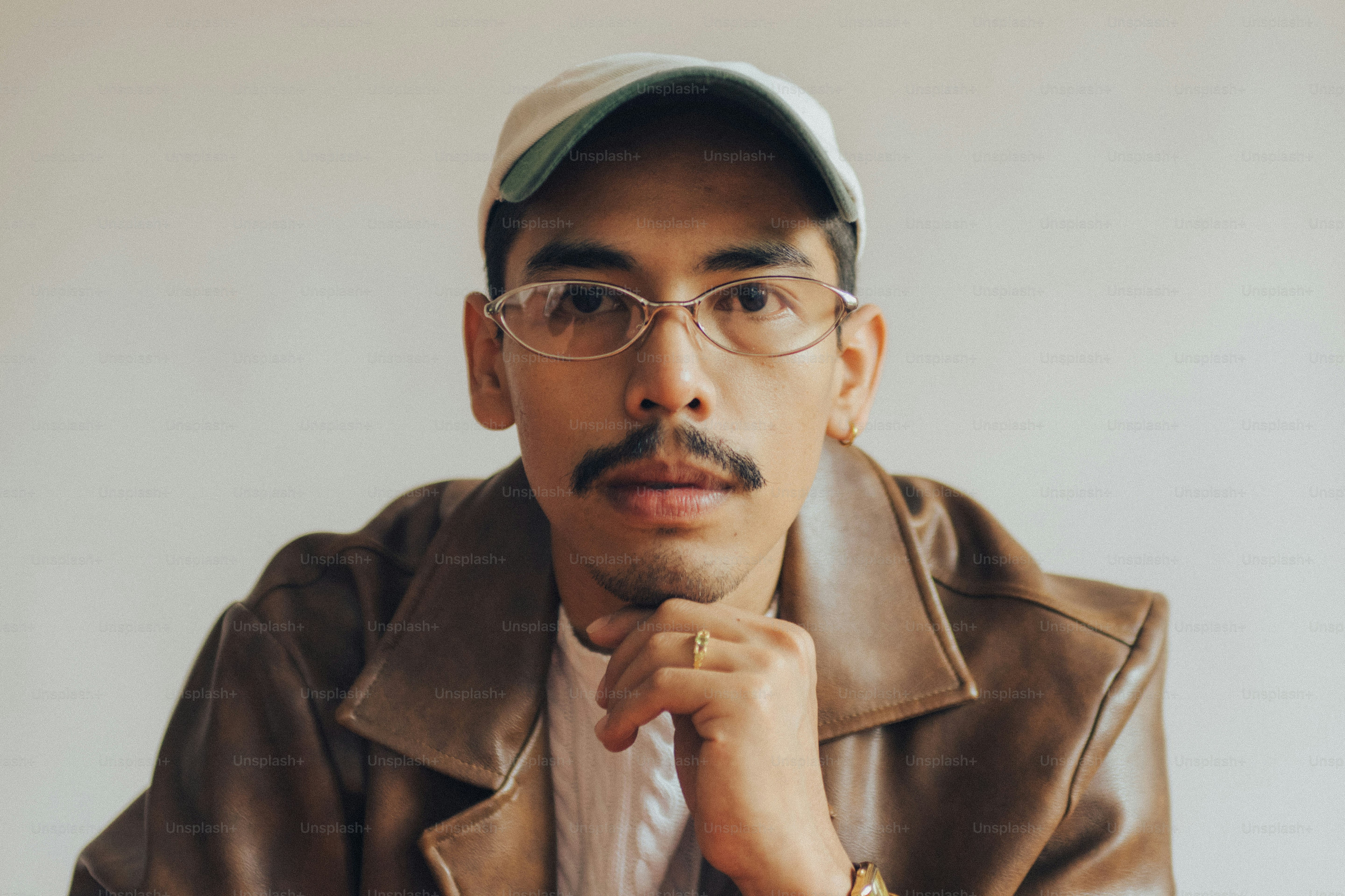 Smiling man with mustache and glasses - Photo on Unsplash+