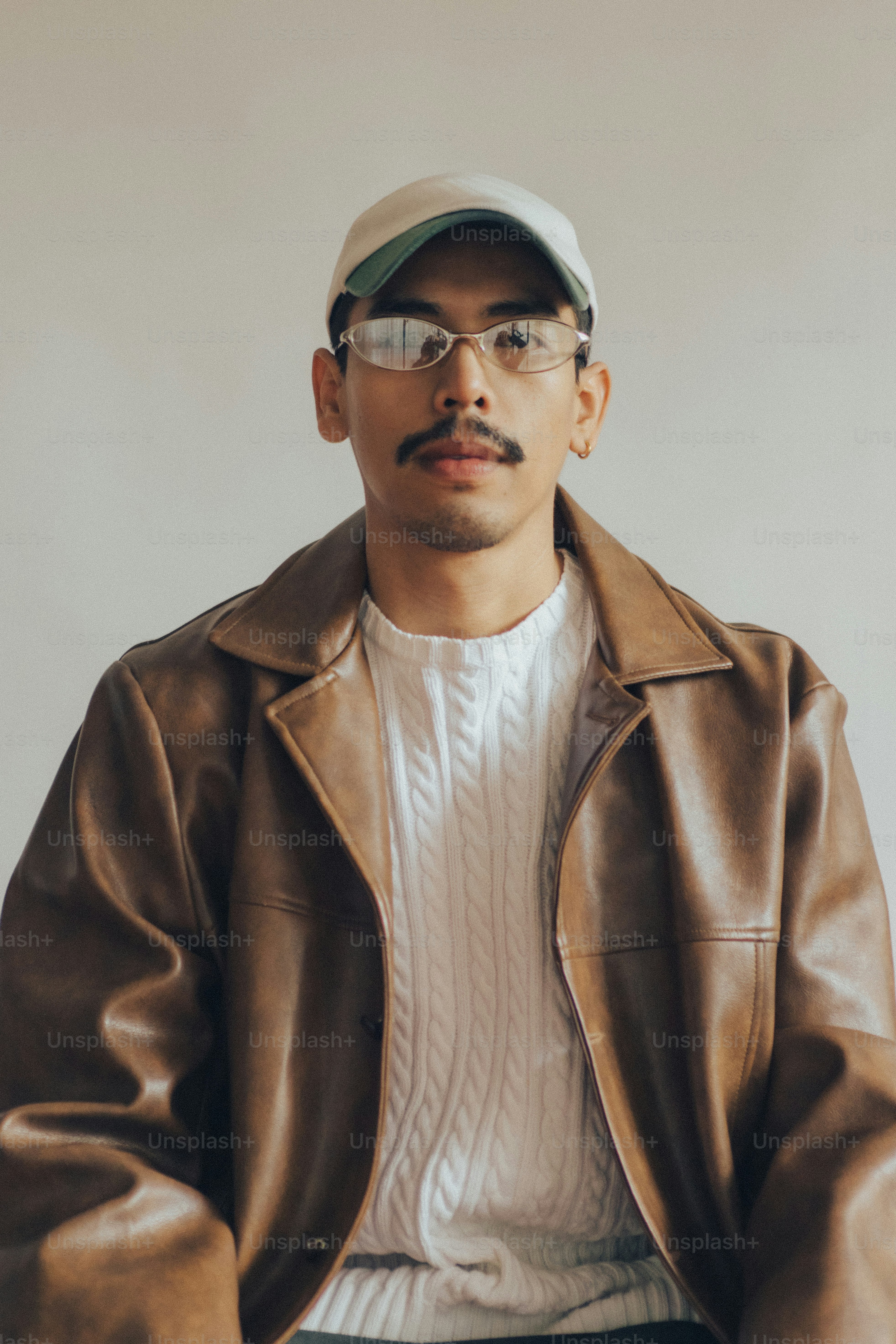 Man with mustache wearing beige cap - Photo on Unsplash+