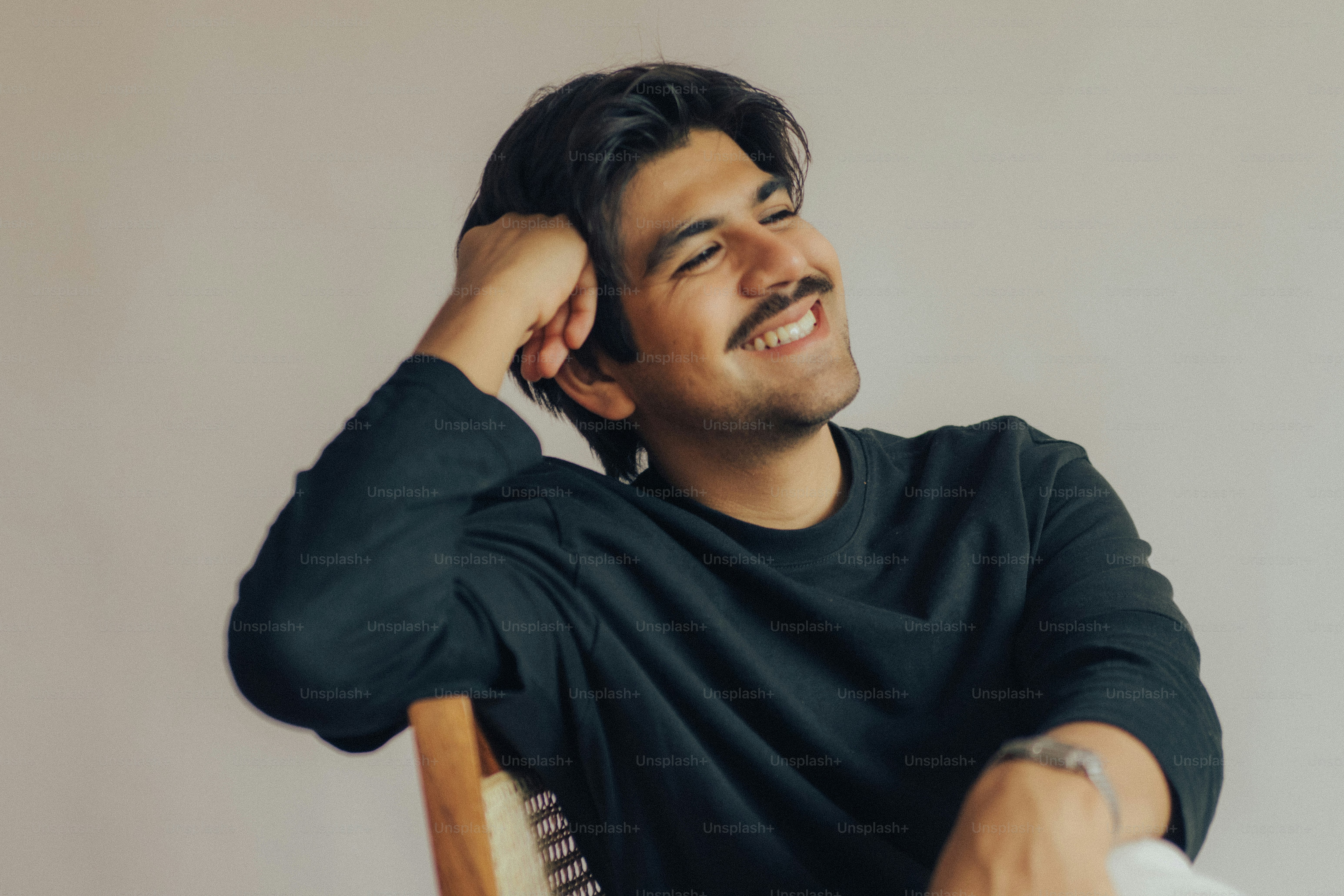 Man with mustache in striped shirt - Photo on Unsplash+